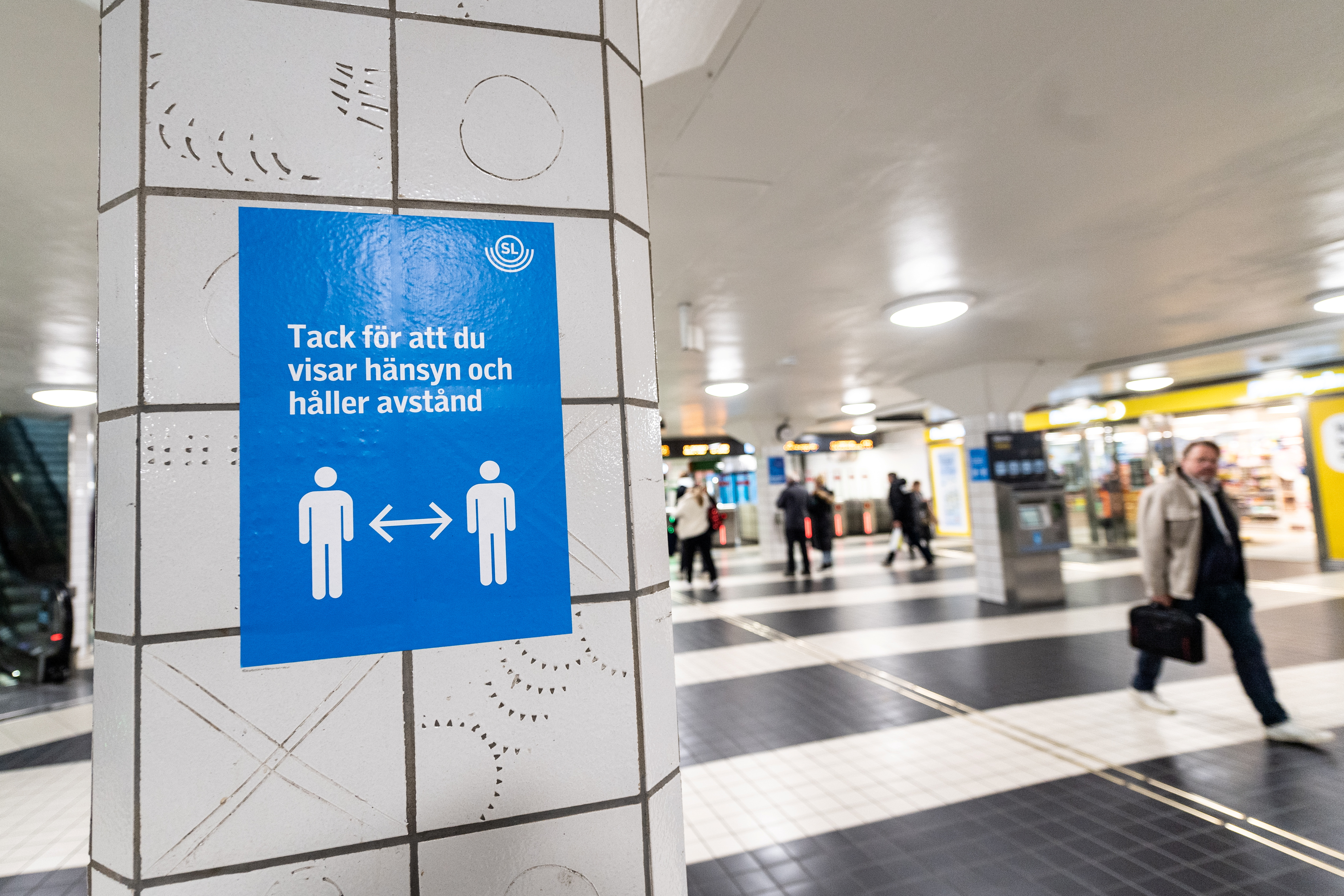 A sign reminding people to respect social distancing is seen amid the coronavirus disease (COVID-19) outbreak, at the Central Station in Stockholm