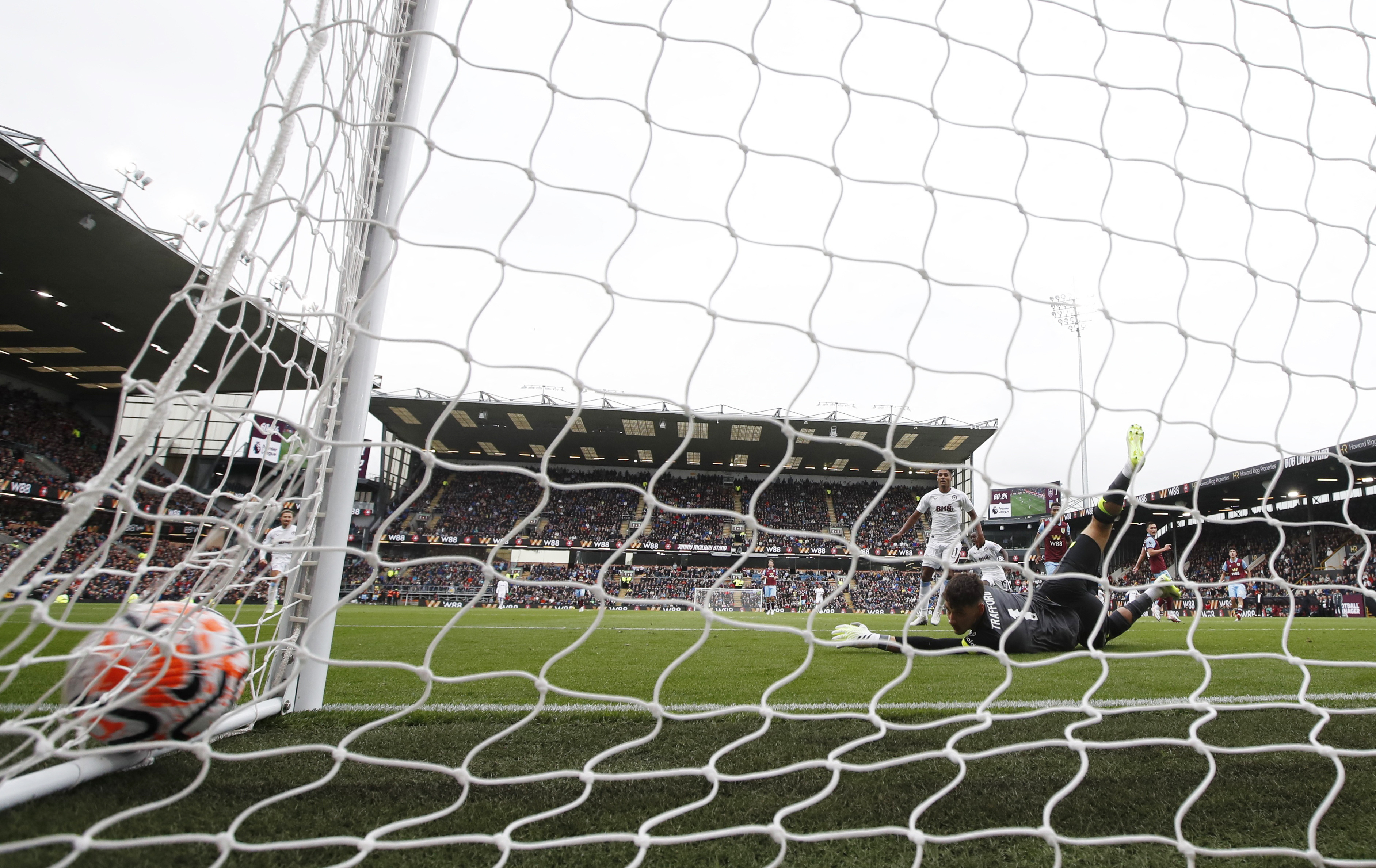 Cash scores 2 in Villa's 3-1 win at Burnley. Brick thrown at