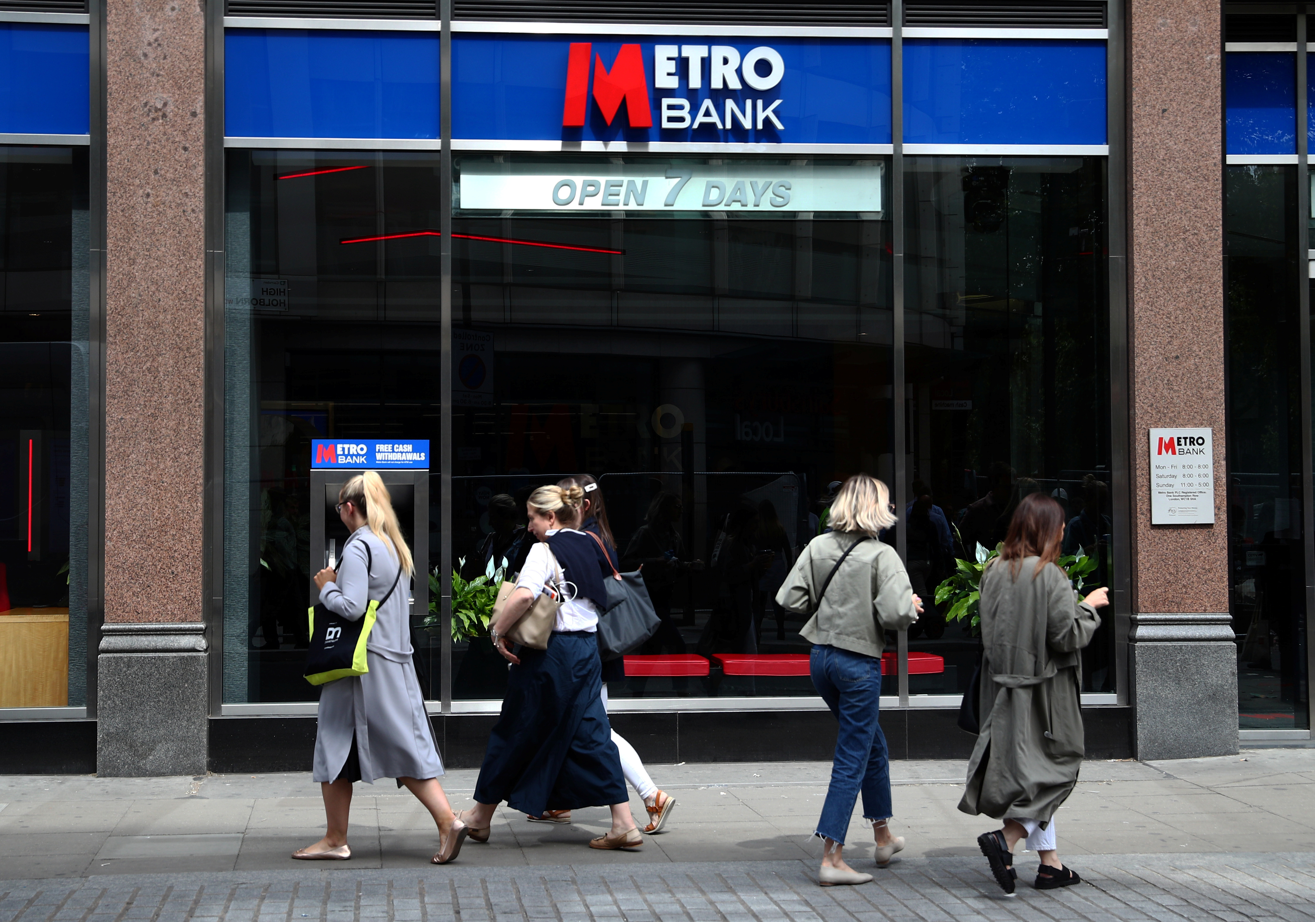 People walk past a branch of Metro Bank in London, Britain, May 22, 2019. REUTERS/Hannah McKay
