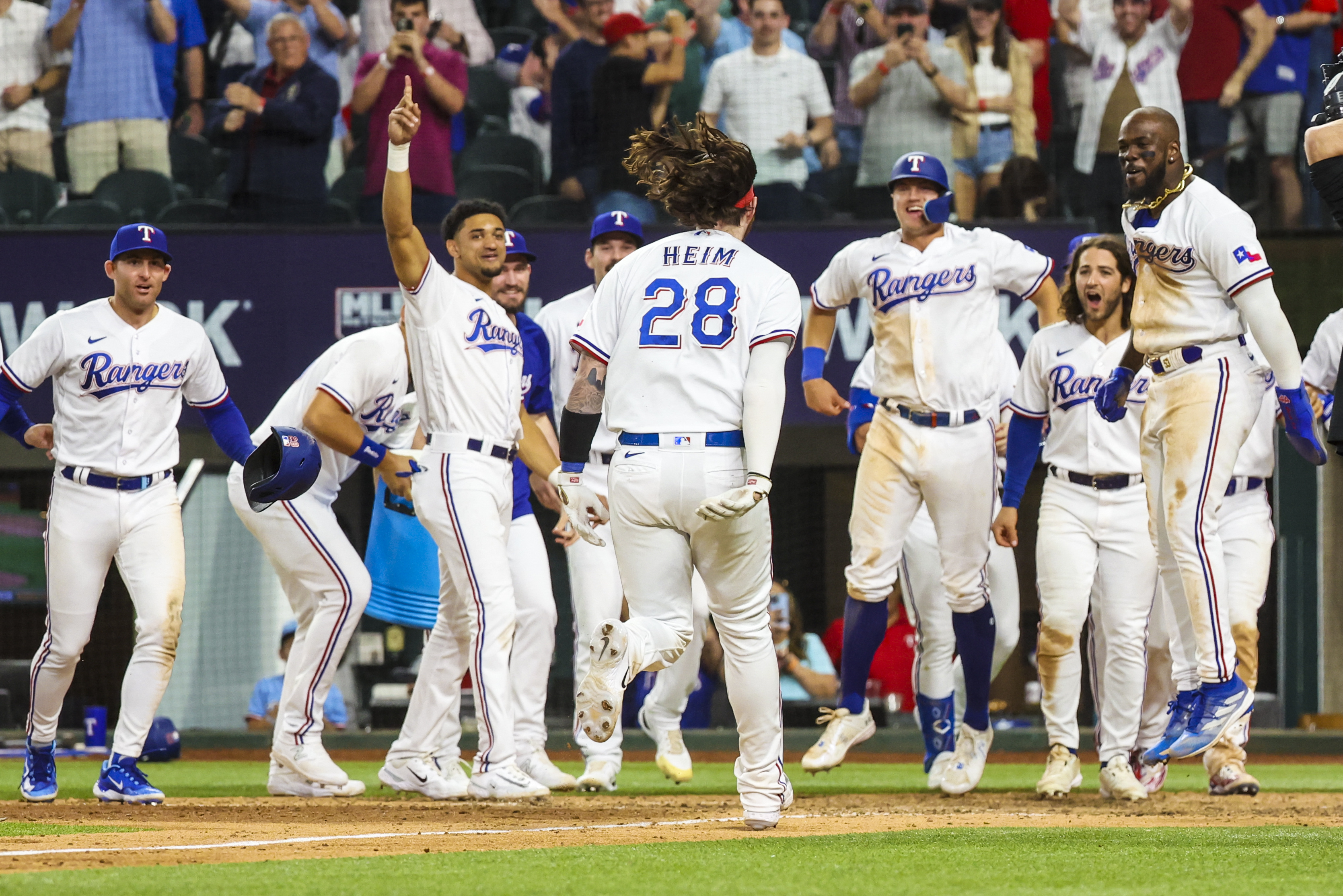 Rangers rally in 10th for walk-off victory over Royals