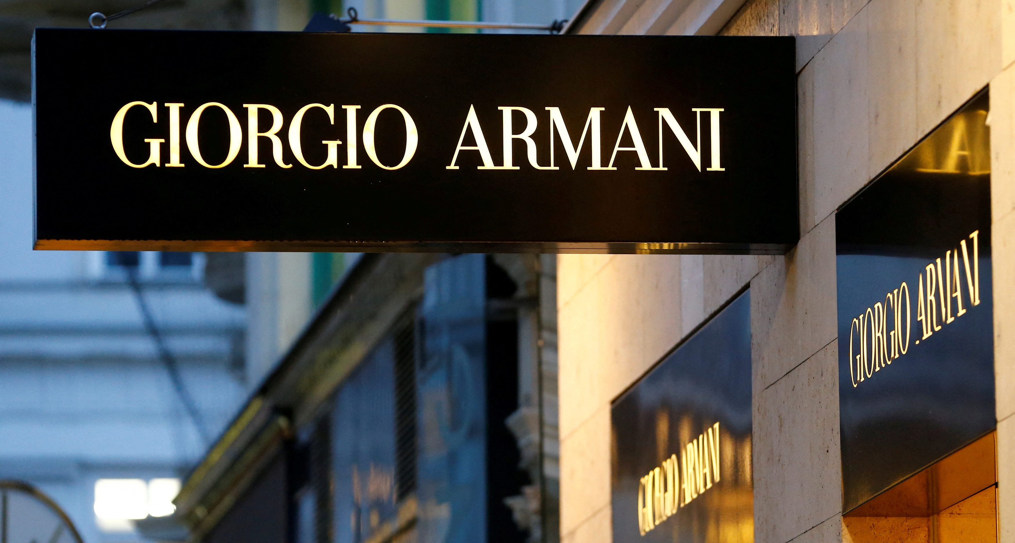 A company logo is pictured outside a Giorgio Armani store in Vienna