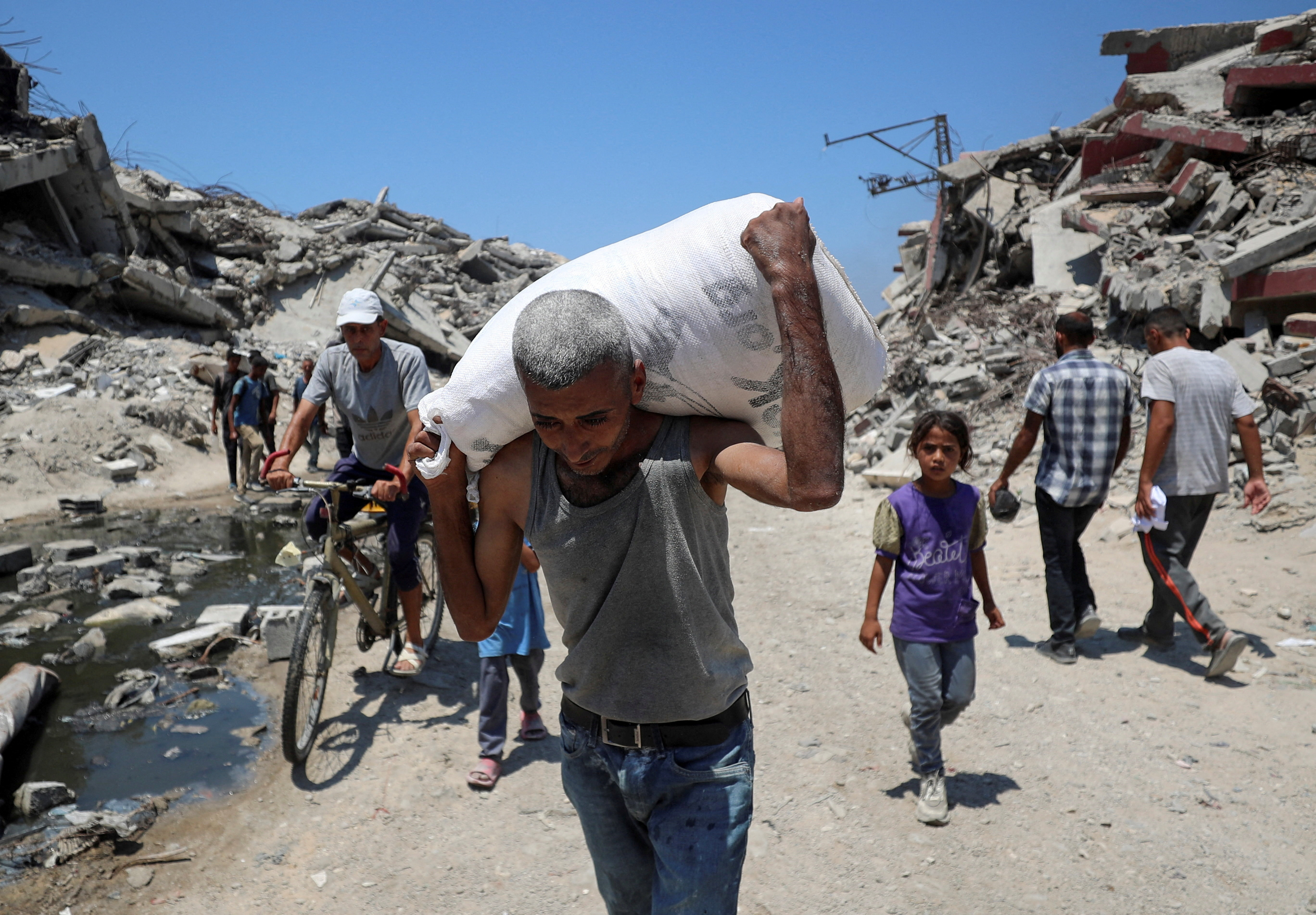 Israel announces daily pauses in Gaza fighting as aid airdrops begin | Reuters