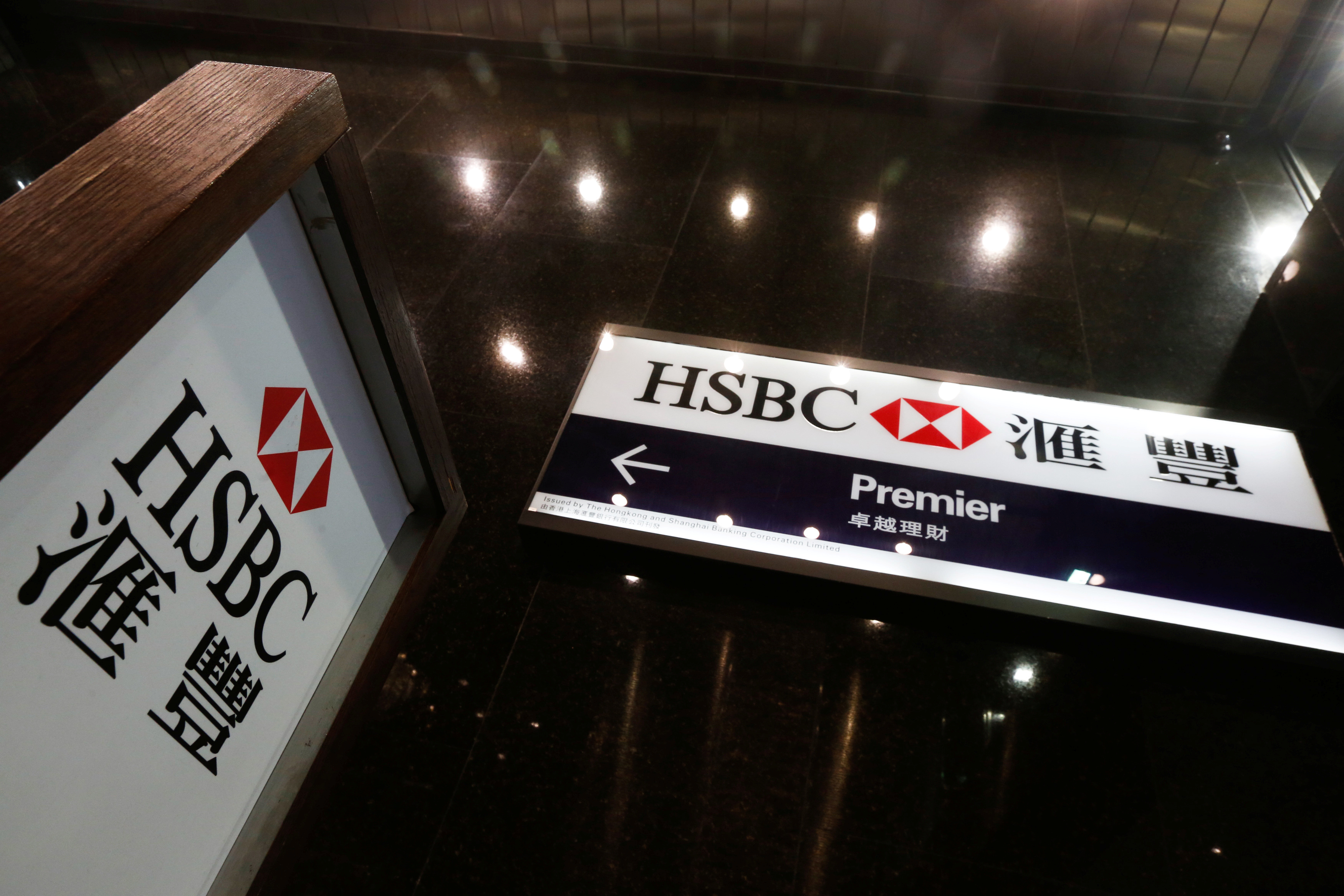 Logos of HSBC are displayed at a major branch at the financial Central district in Hong Kong