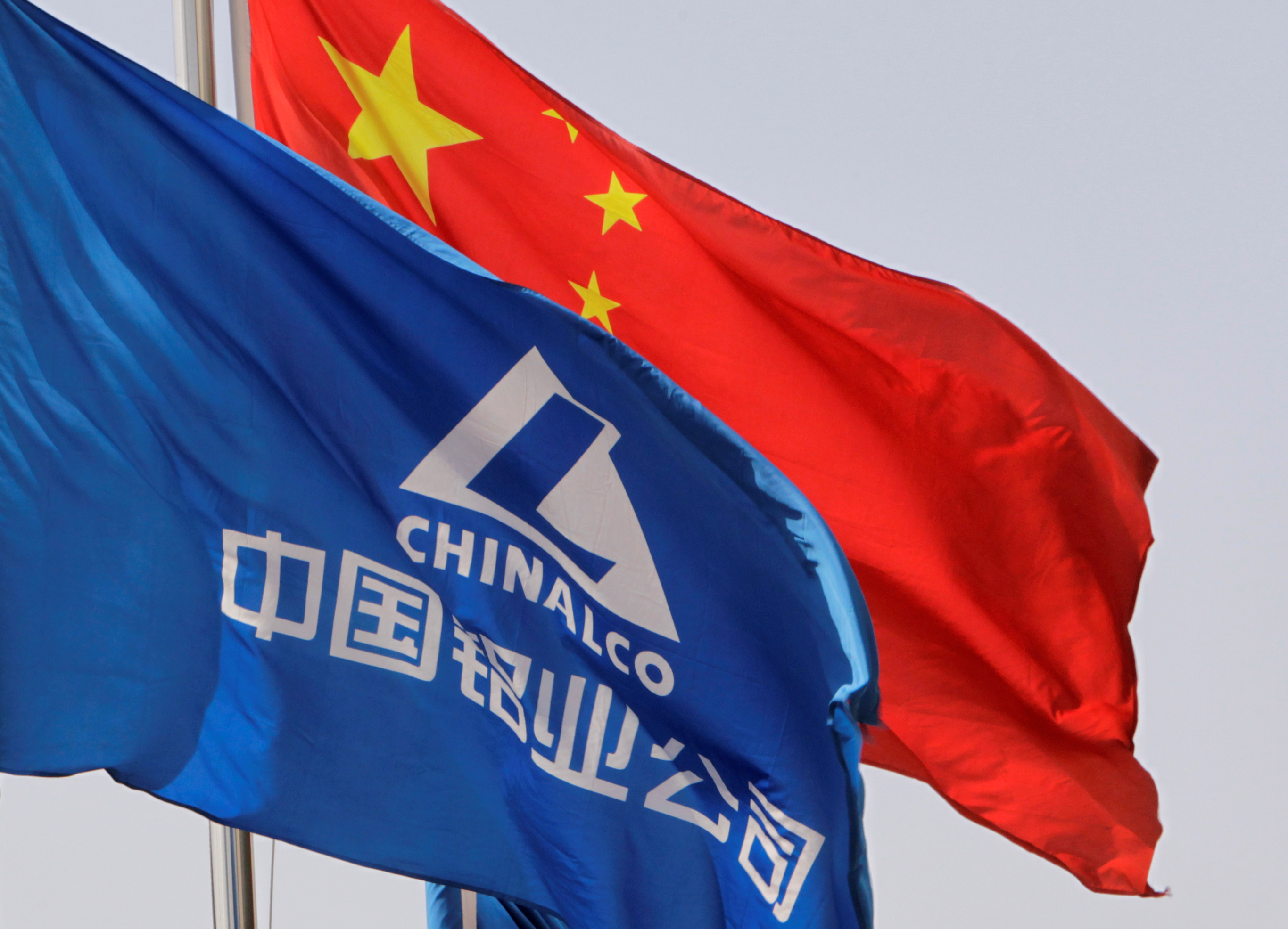 Aluminum Corp of China flag flutters outside its headquarters in Beijing