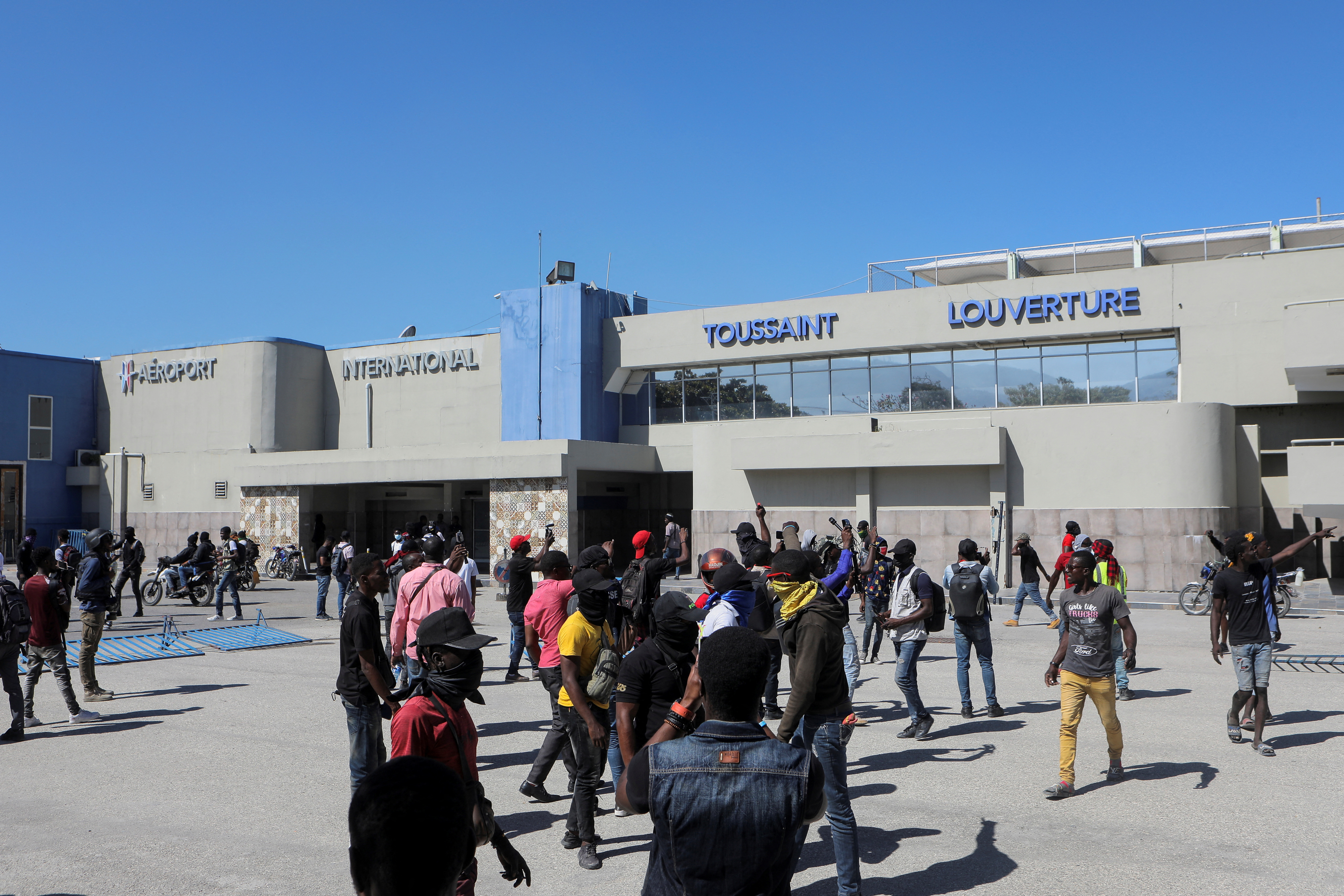 Demonstrators break into the Toussaint Louverture International Airport to protest the recent killings of police officers by armed gangs, in Port-au-Prince
