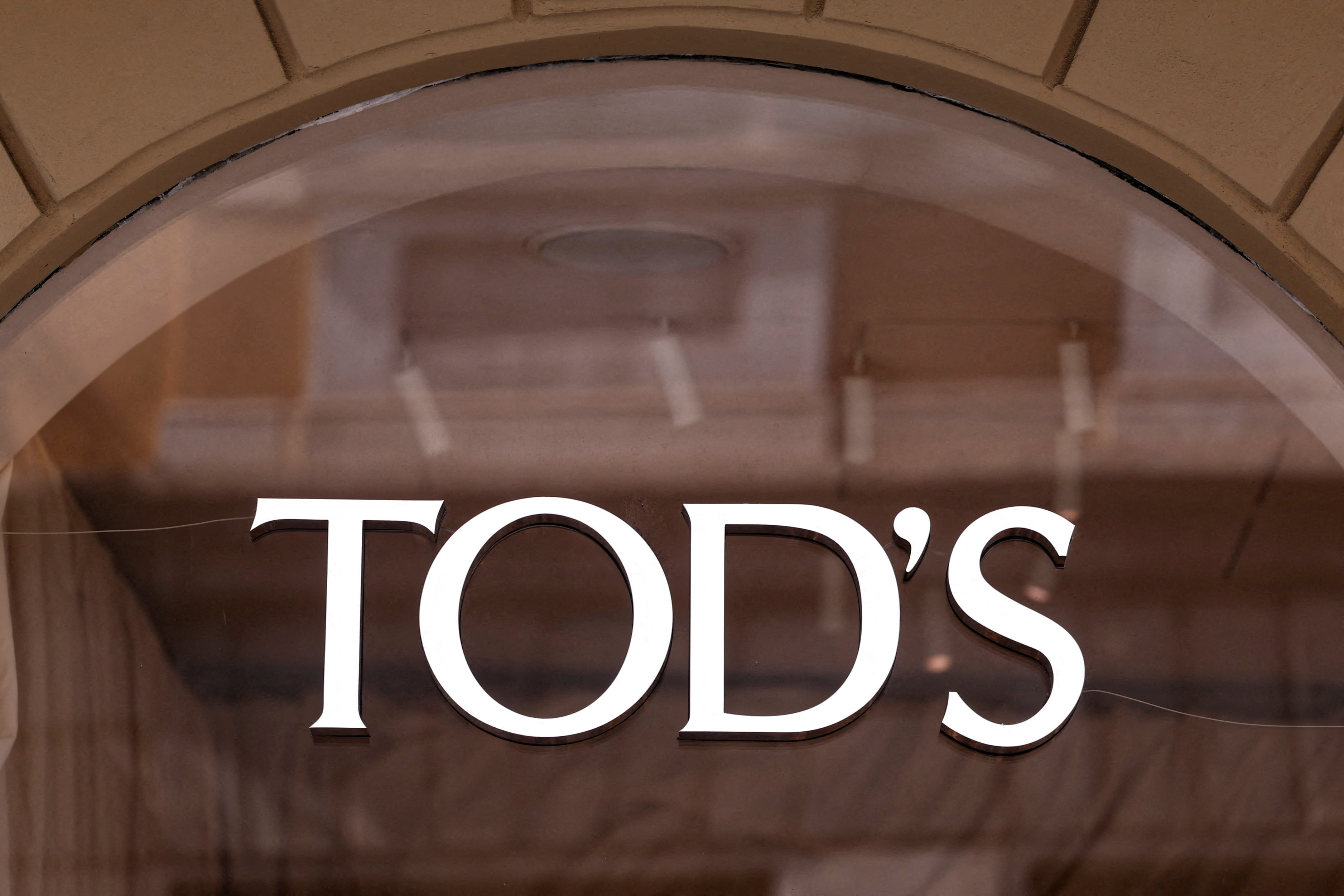 The logo of fashion house Tod's is seen outside a shop in Milan