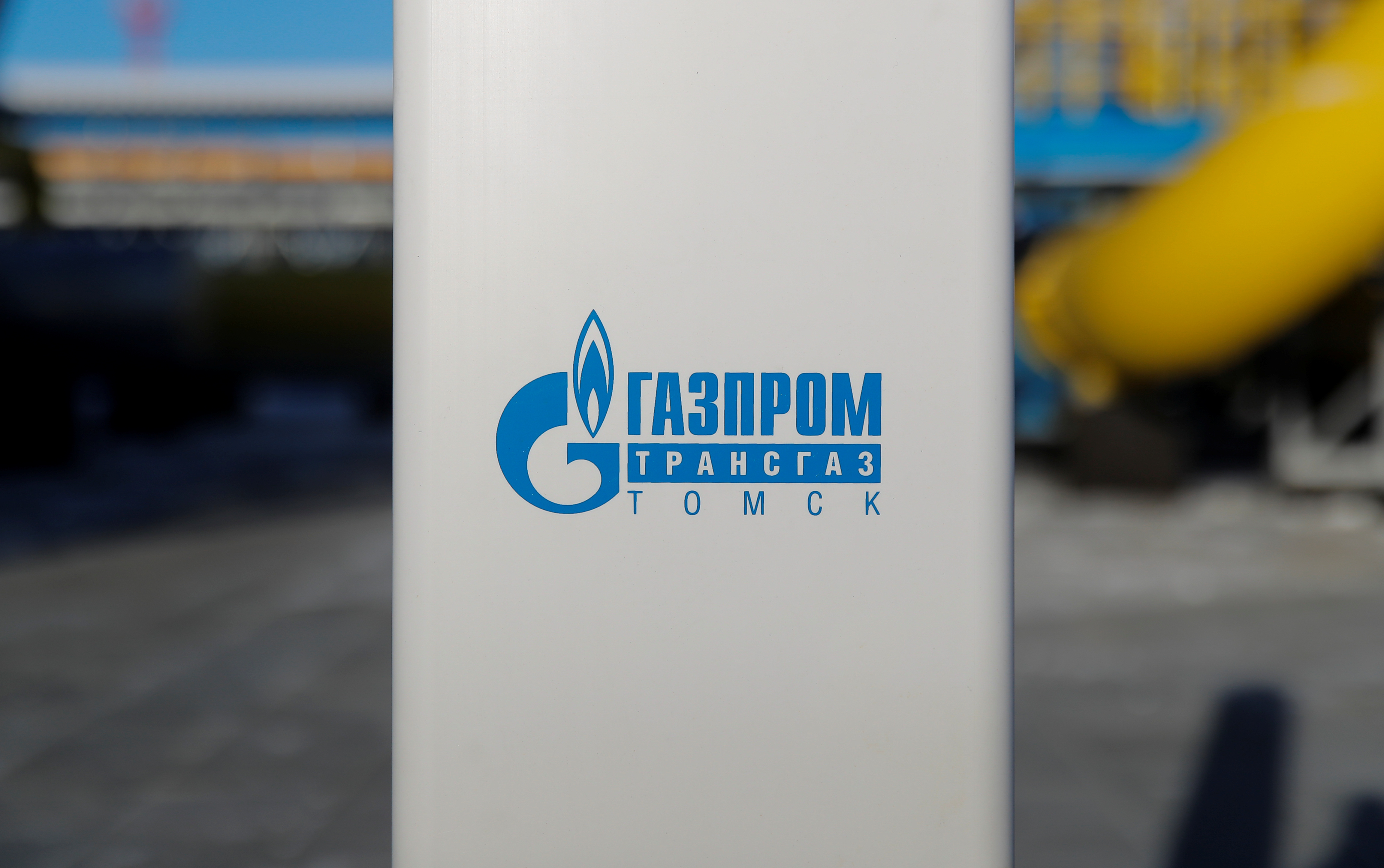 A logo of Gazprom Transgaz Tomsk is pictured at the Atamanskaya compressor station, facility of Gazprom's Power Of Siberia project outside the far eastern town of Svobodny