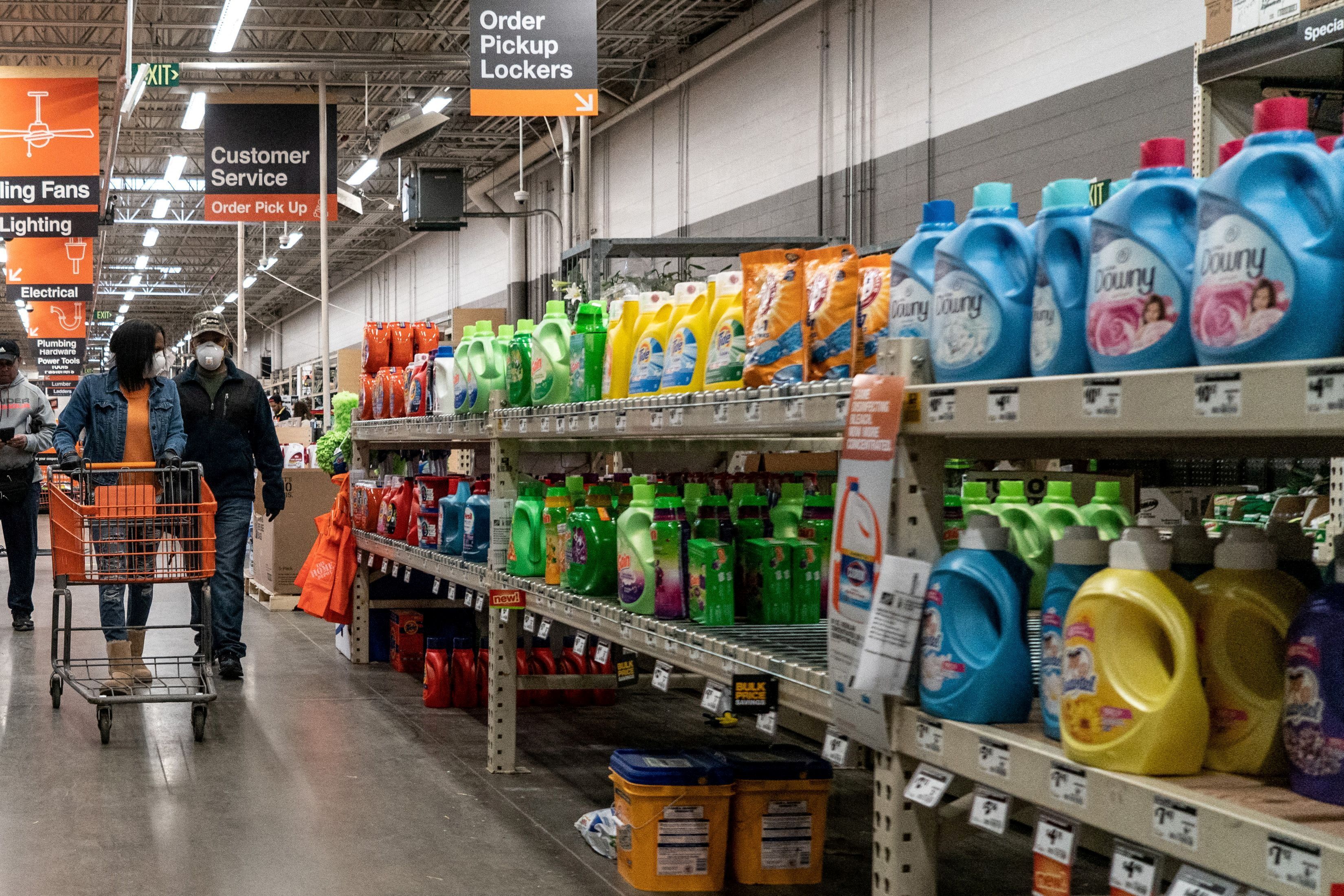 Shoppers browse in a Home Depot building supplies store while wearing masks to help slow the spread of coronavirus disease (COVID-19) in north St. Louis, Missouri, U.S. April 4, 2020. Picture taken April 4, 2020.  REUTERS/Lawrence Bryant/File Photo/File Photo