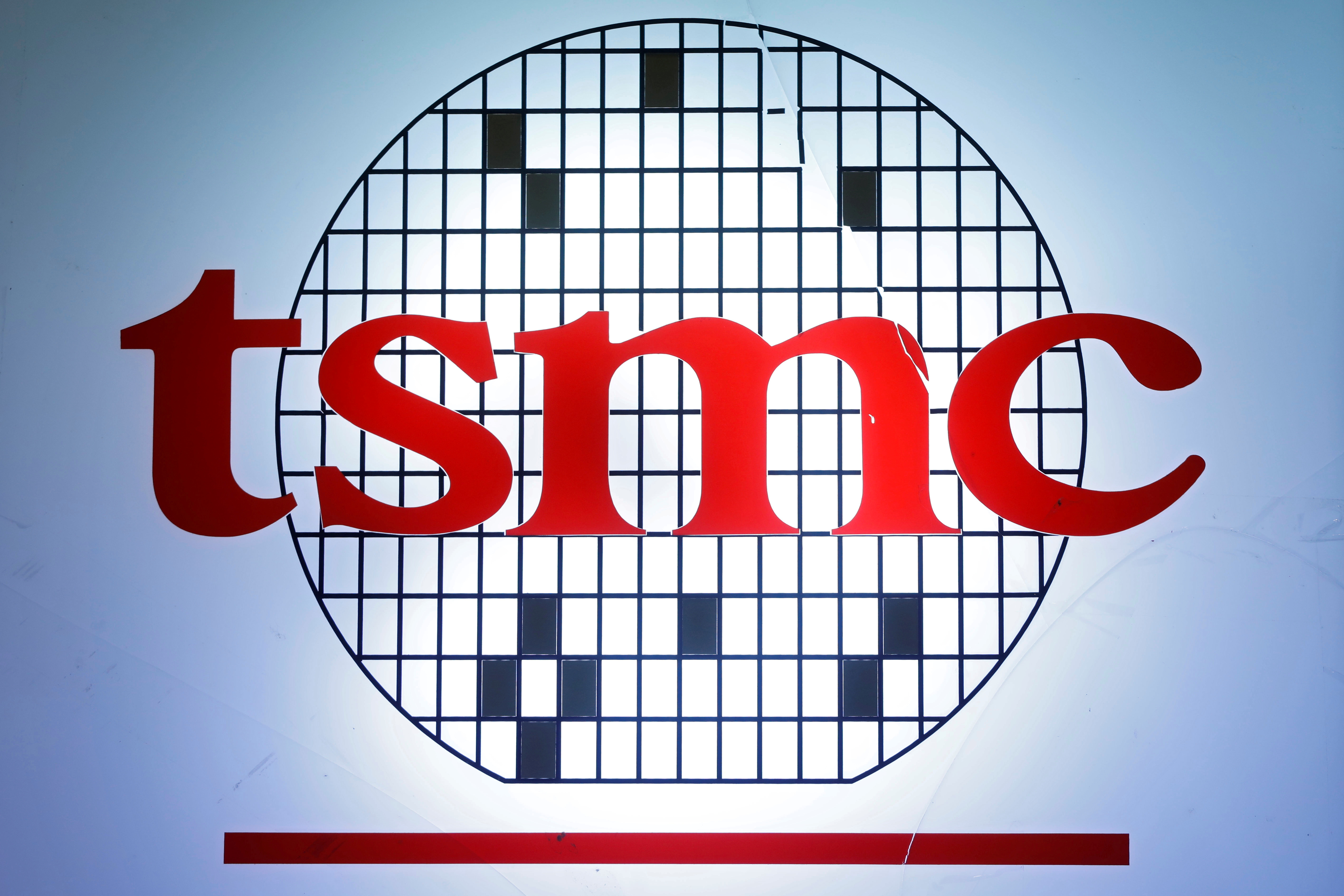 The logo of Taiwan Semiconductor Manufacturing Company (TSMC) is seen during an investors' conference in Taipei