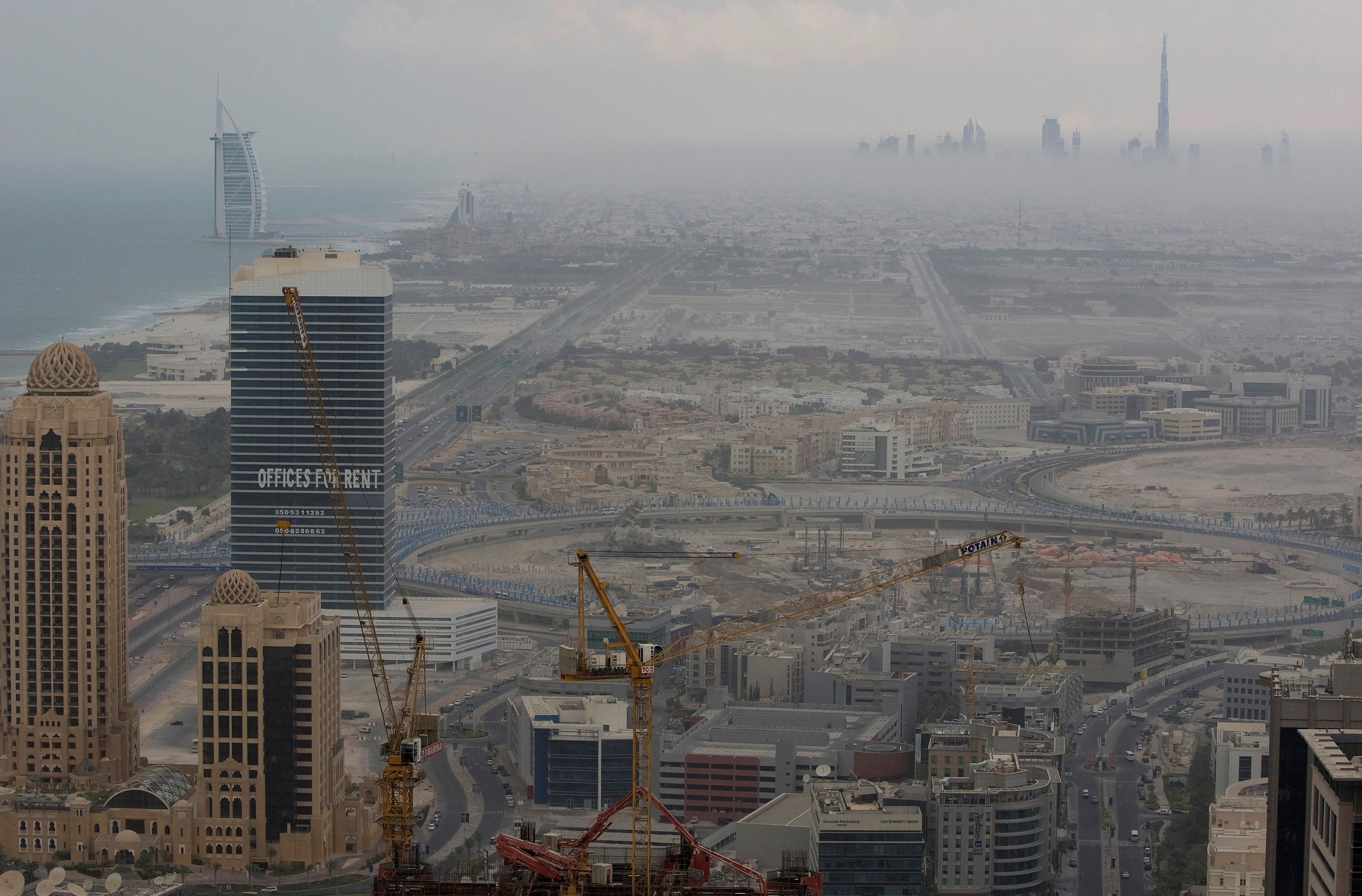 An early evening view of the Burj Dubai and Burj Al Arab with construction work in the foreground