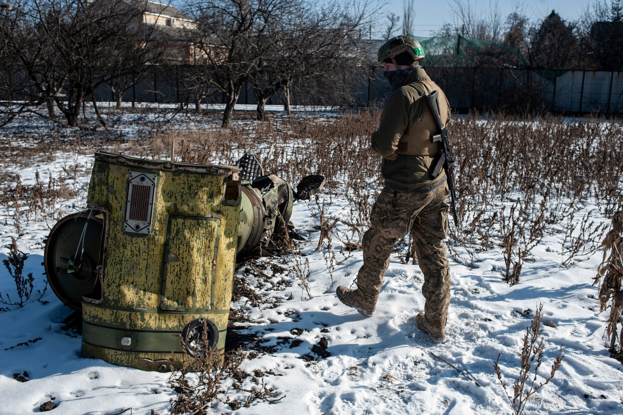 Ukrainian service member checks parts of a Tochka-U ballistic missile in the frontline town of Bakhmut