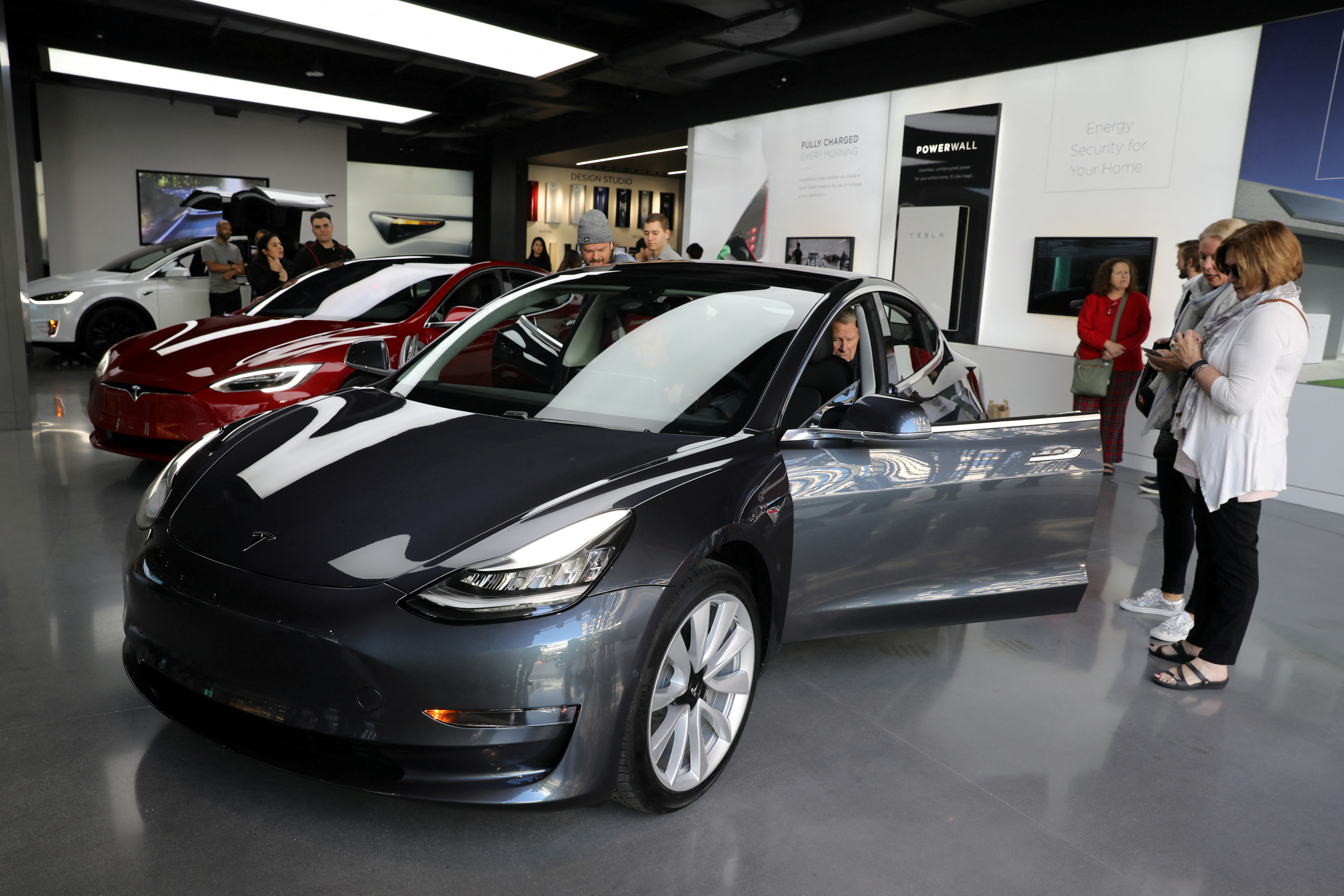 A Tesla Model 3 is seen in a showroom in Los Angeles