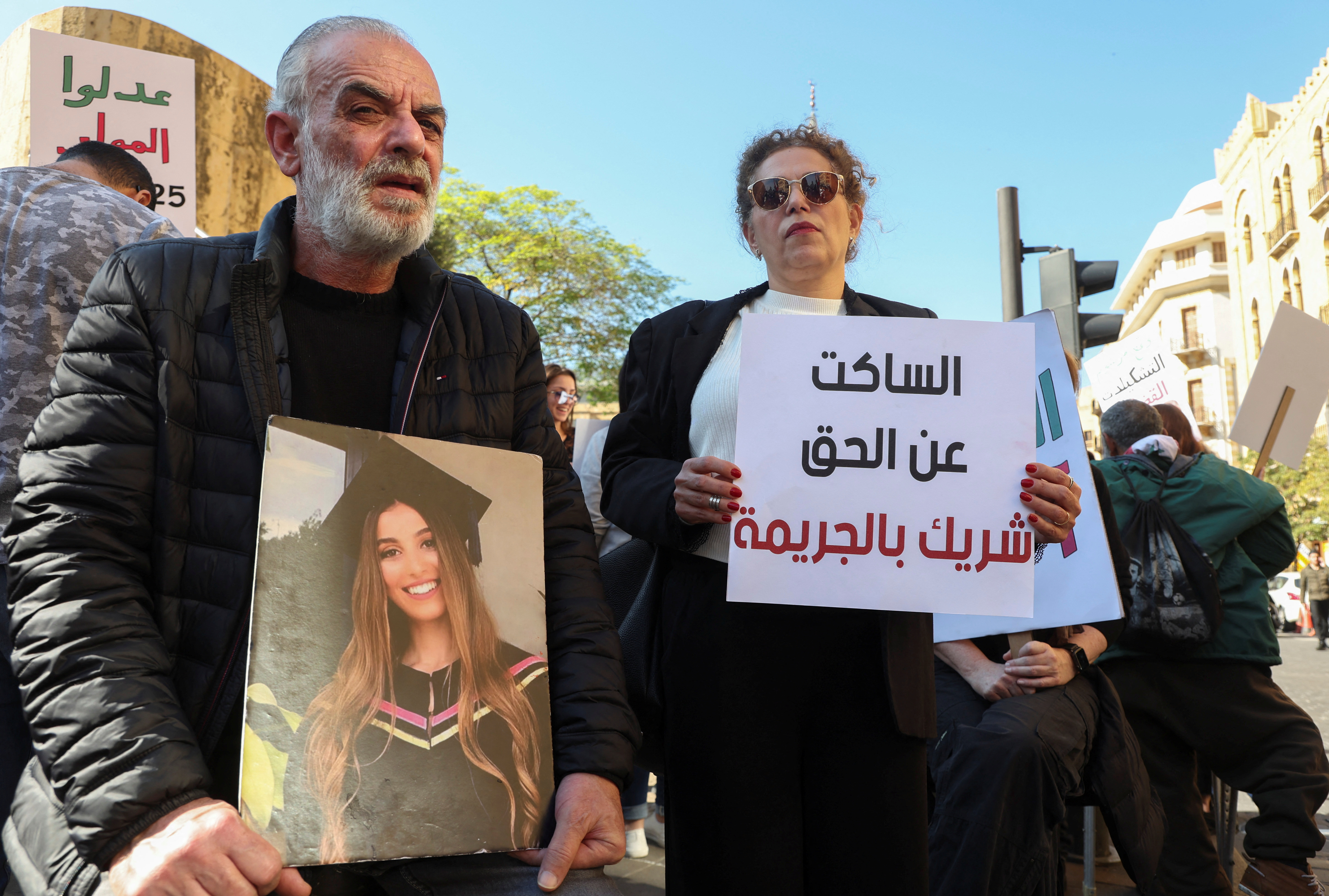Relatives of some of the victims of the 2020 Beirut port explosion attend a protest near the parliament building in Beirut