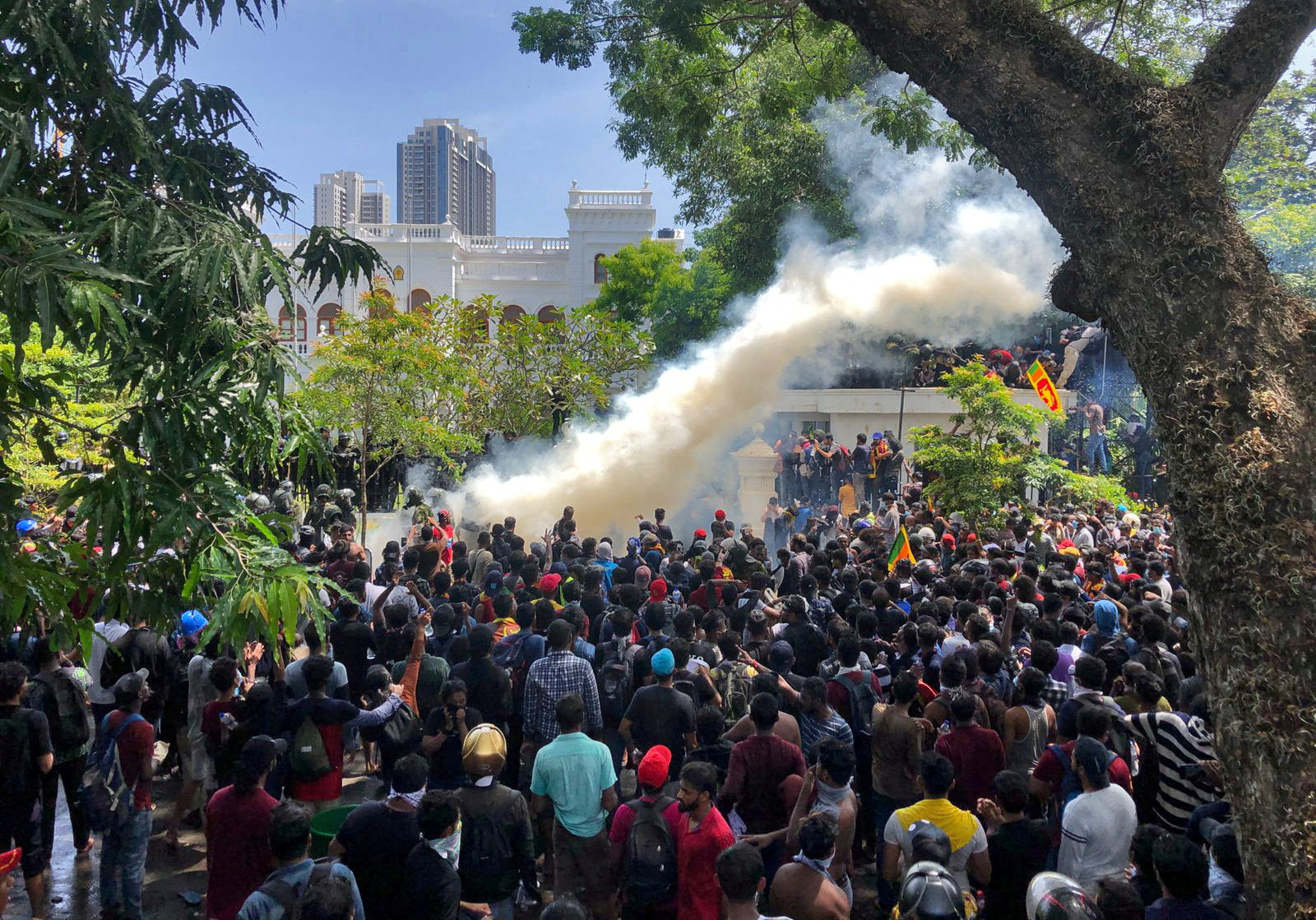 Demonstrators gather outside the office of Sri Lanka's PM Wickremesinghe, in Colombo