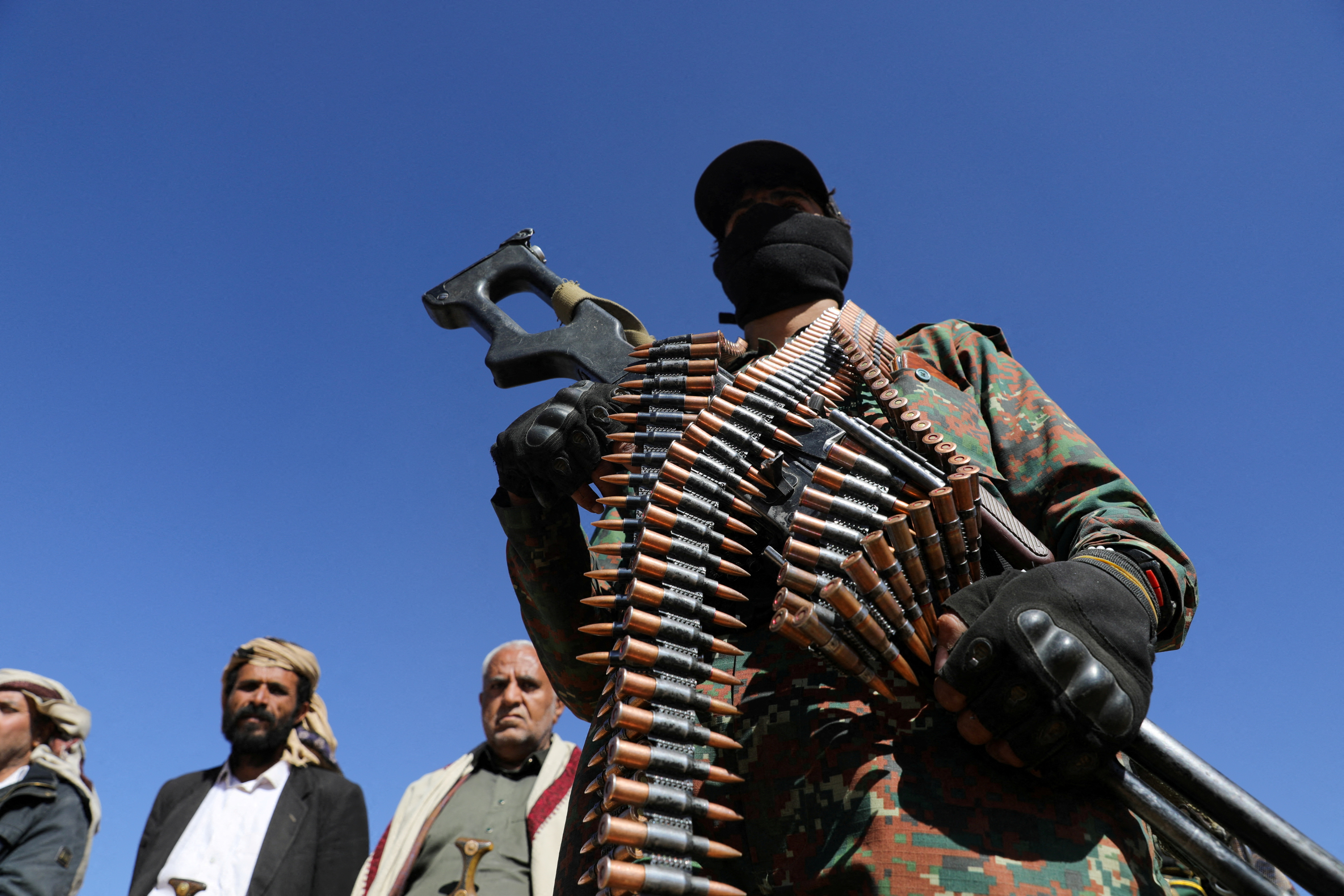 Houthi policeman takes part in a protest against recent U.S.-led strikes on Houthi targets, near Sanaa