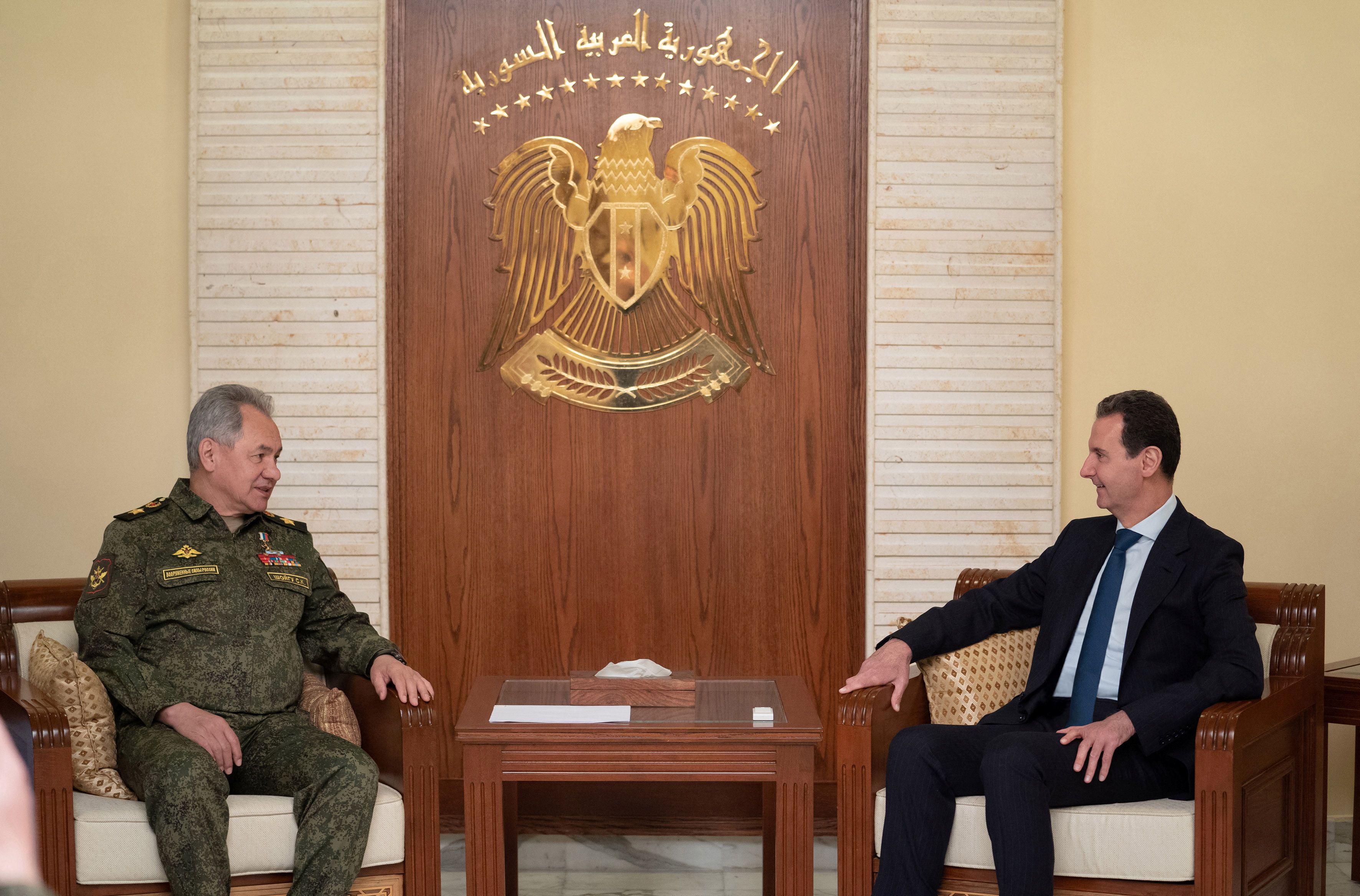 Syria's President Bashar al-Assad meets with Russian Defence Minister Sergei Shoigu in Damascus, Syria, in this handout released by SANA on February 15, 2022. Picture taken February 15, 2022. SANA/Handout via REUTERS 