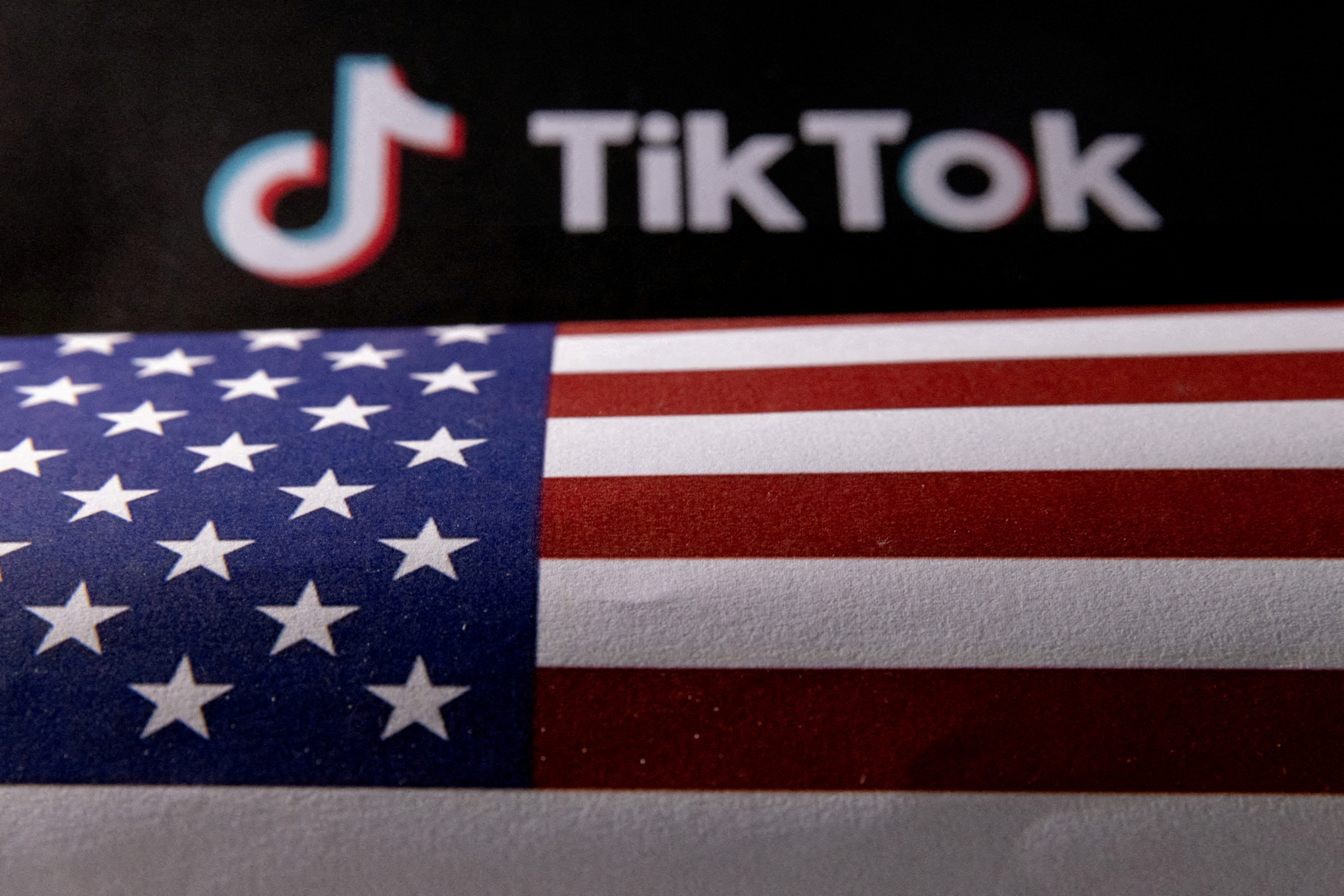 Illustration shows U.S. flag and TikTok logo