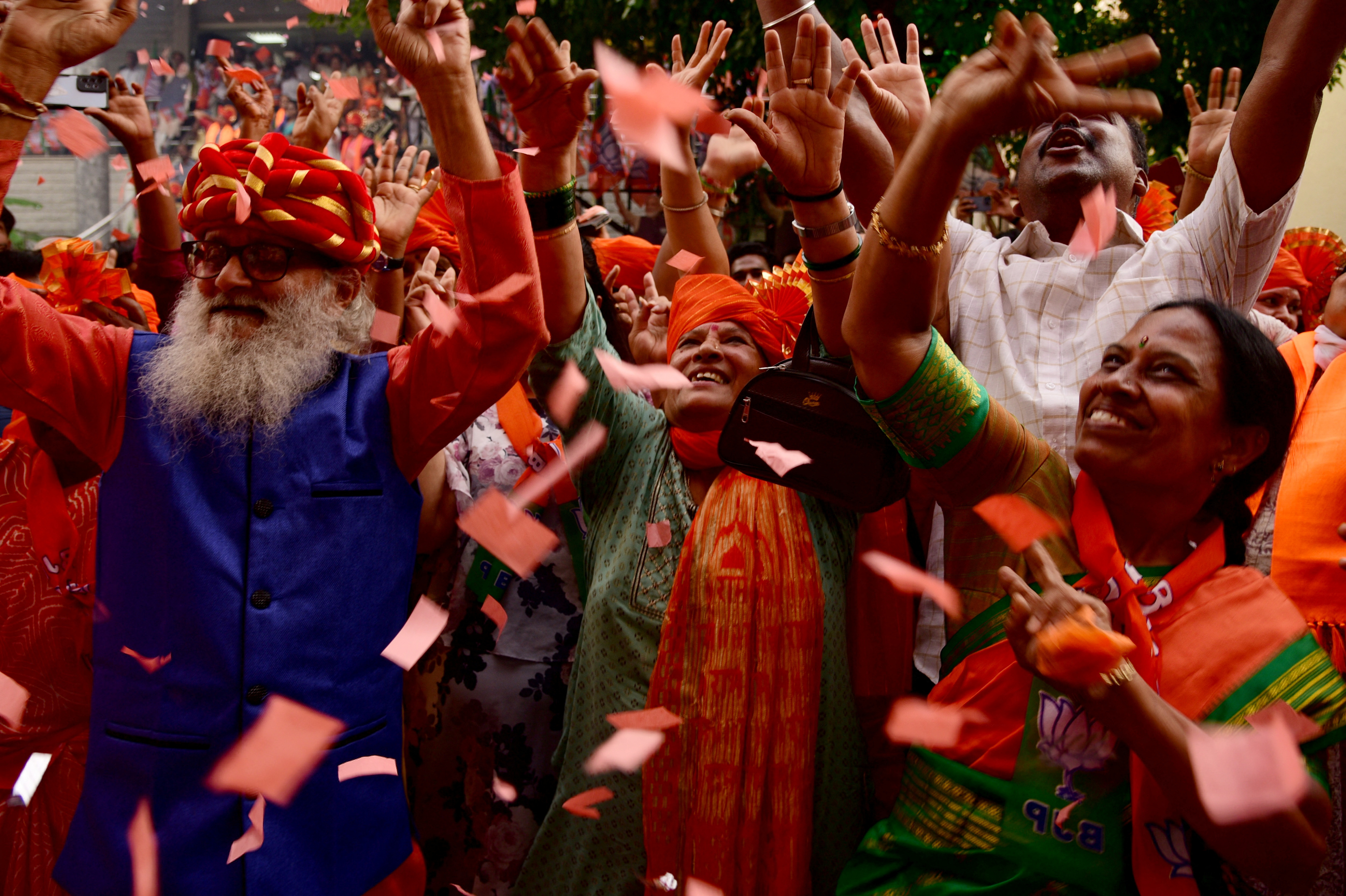 Supporters of India's BJP celebrate on the day of the general election results, outside the party office in Bengaluru