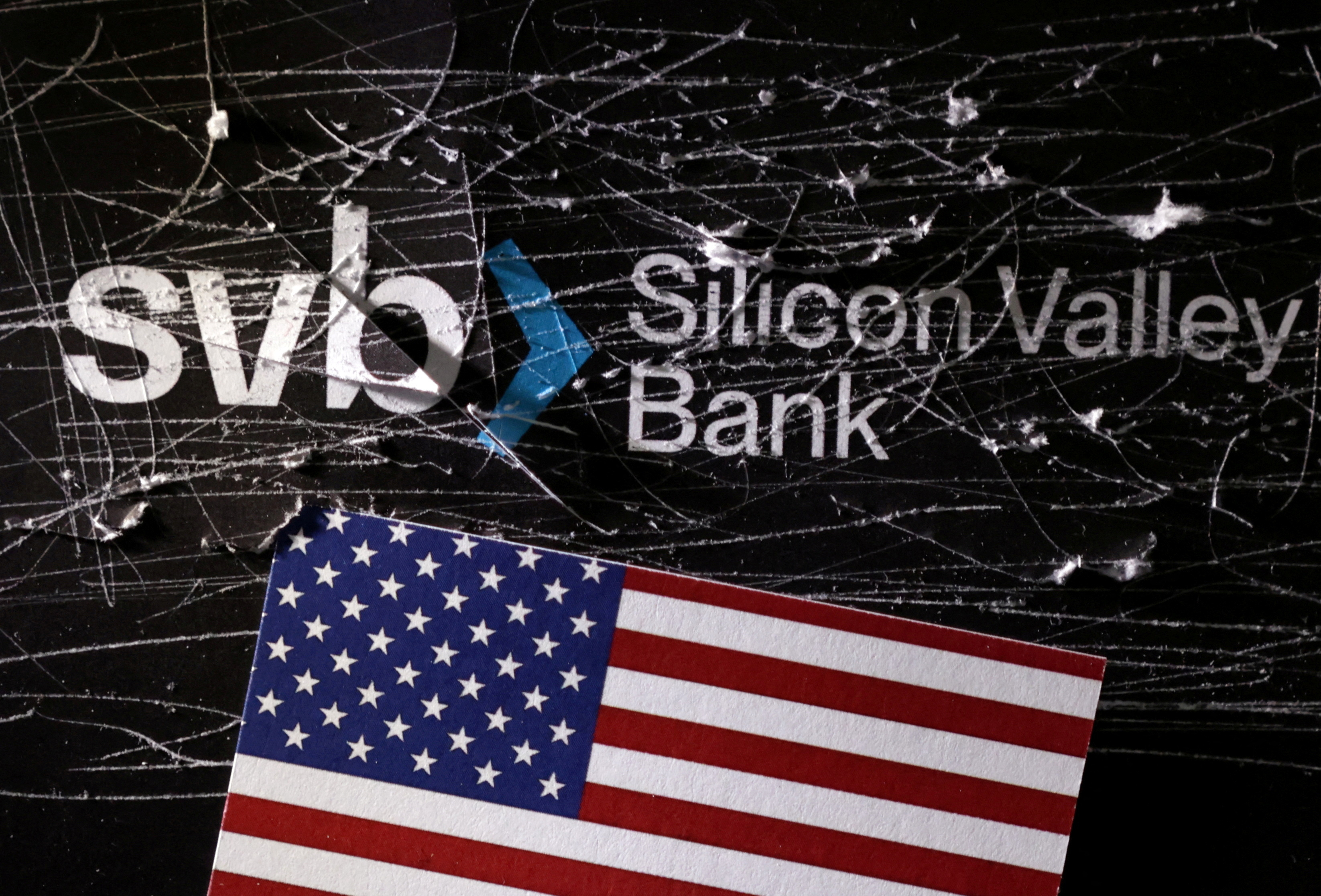 Illustration shows destroyed SVB (Silicon Valley Bank) logo and U.S. flag