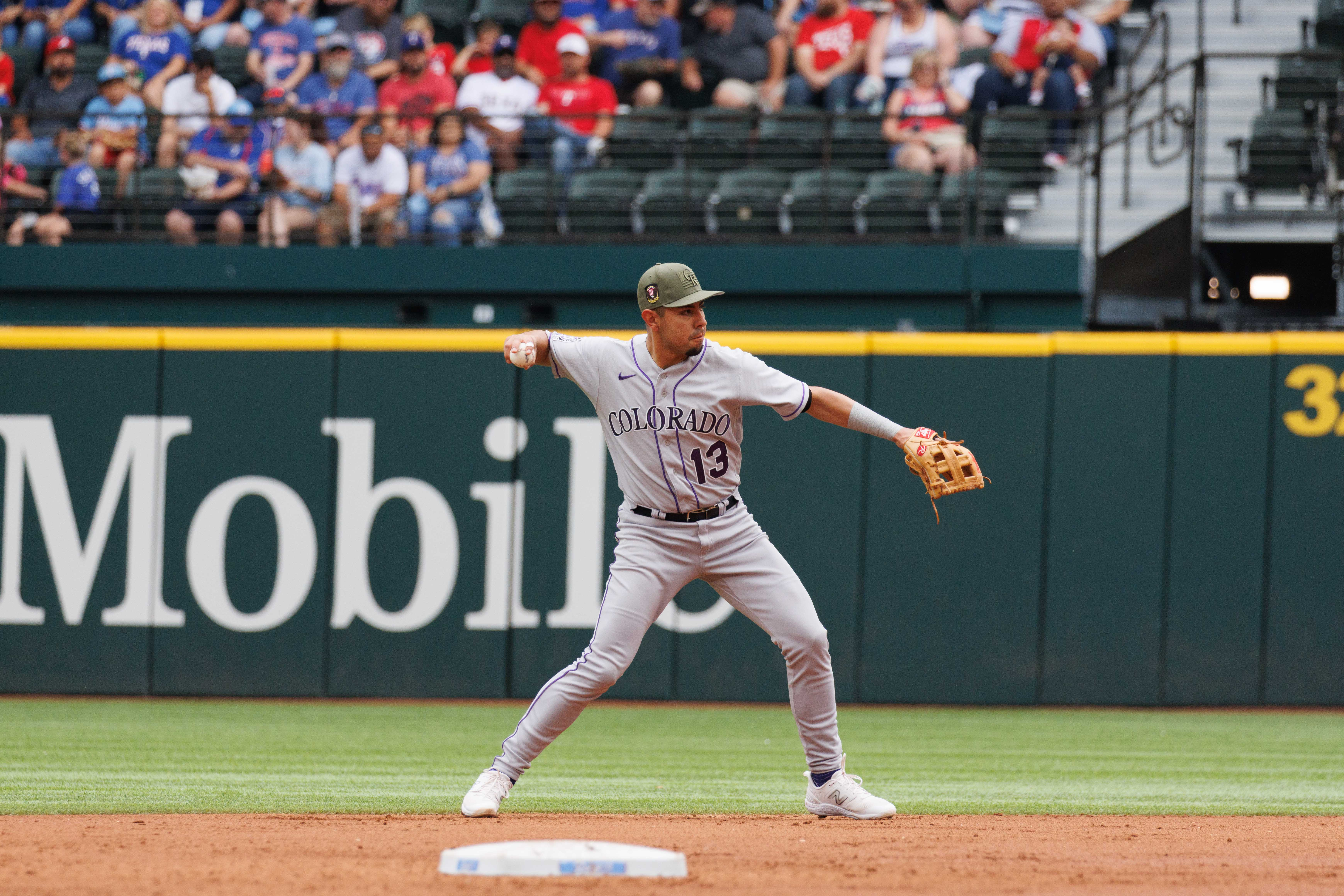 Rangers flex muscles in 13-3 rout to sweep Rockies