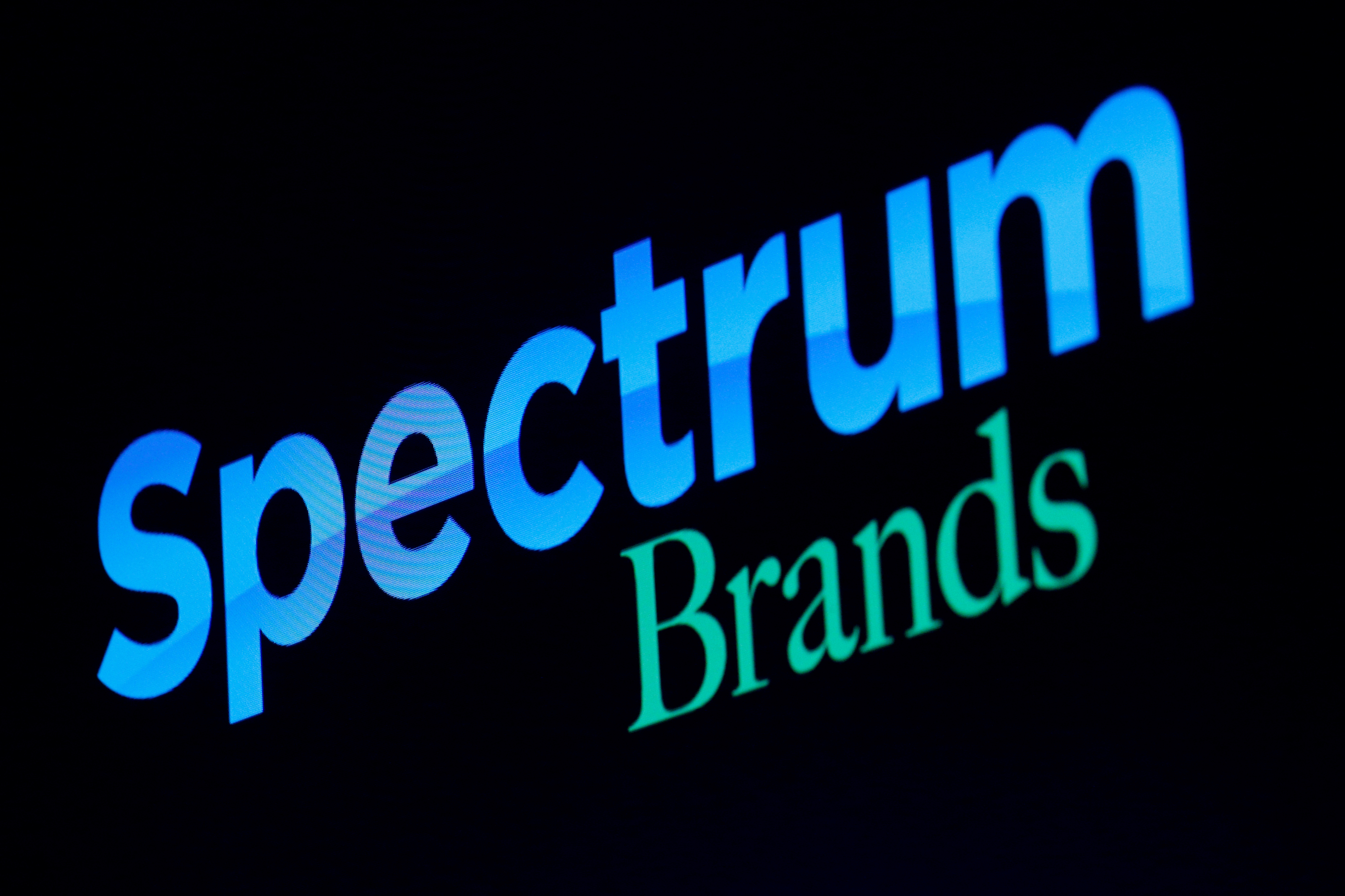 The logo for Spectrum Brands Holdings, Inc., is displayed screen on the floor of the NYSE in New York