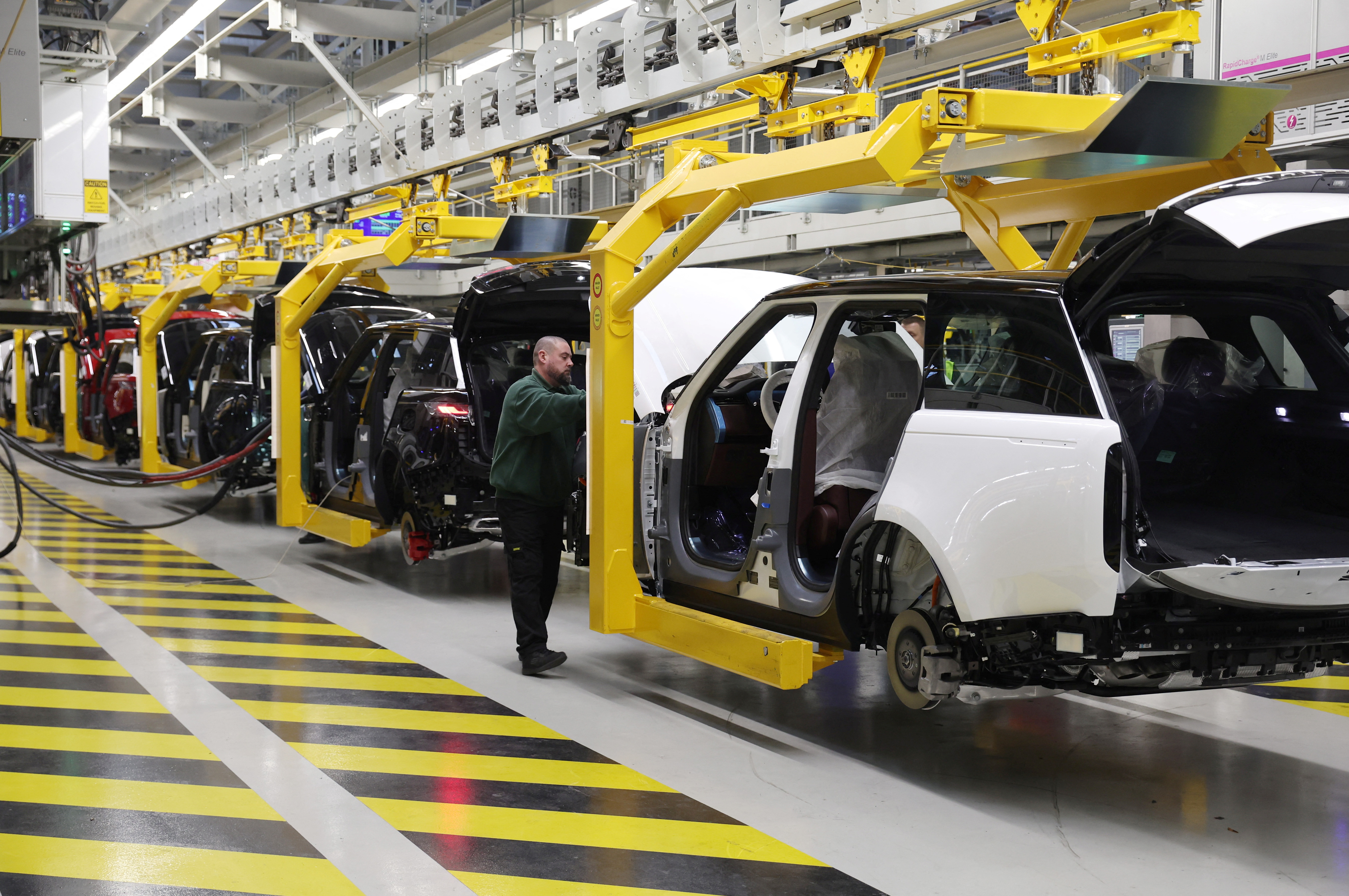 A member of staff works on the production line at Jaguar Land Rover’s factory in Solihull