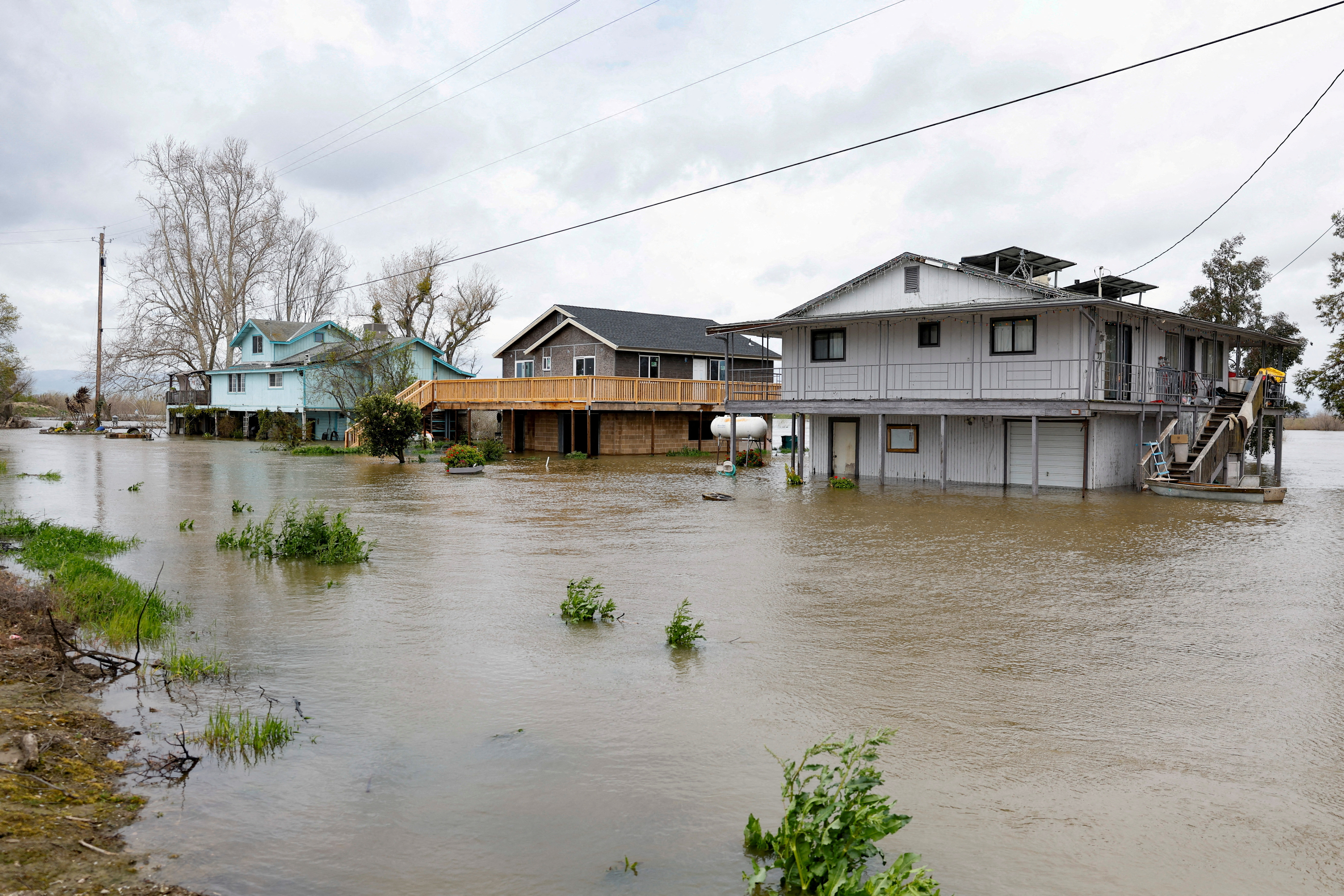 Houses sit partly underwater after the San Joaquin River overflowed, in Manteca