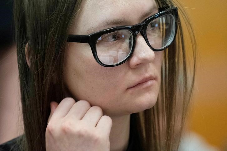Anna Sorokin, who a New York jury convicted last month of swindling more than $200,000 from banks and people, looks on during her sentencing at Manhattan State Supreme Court New York