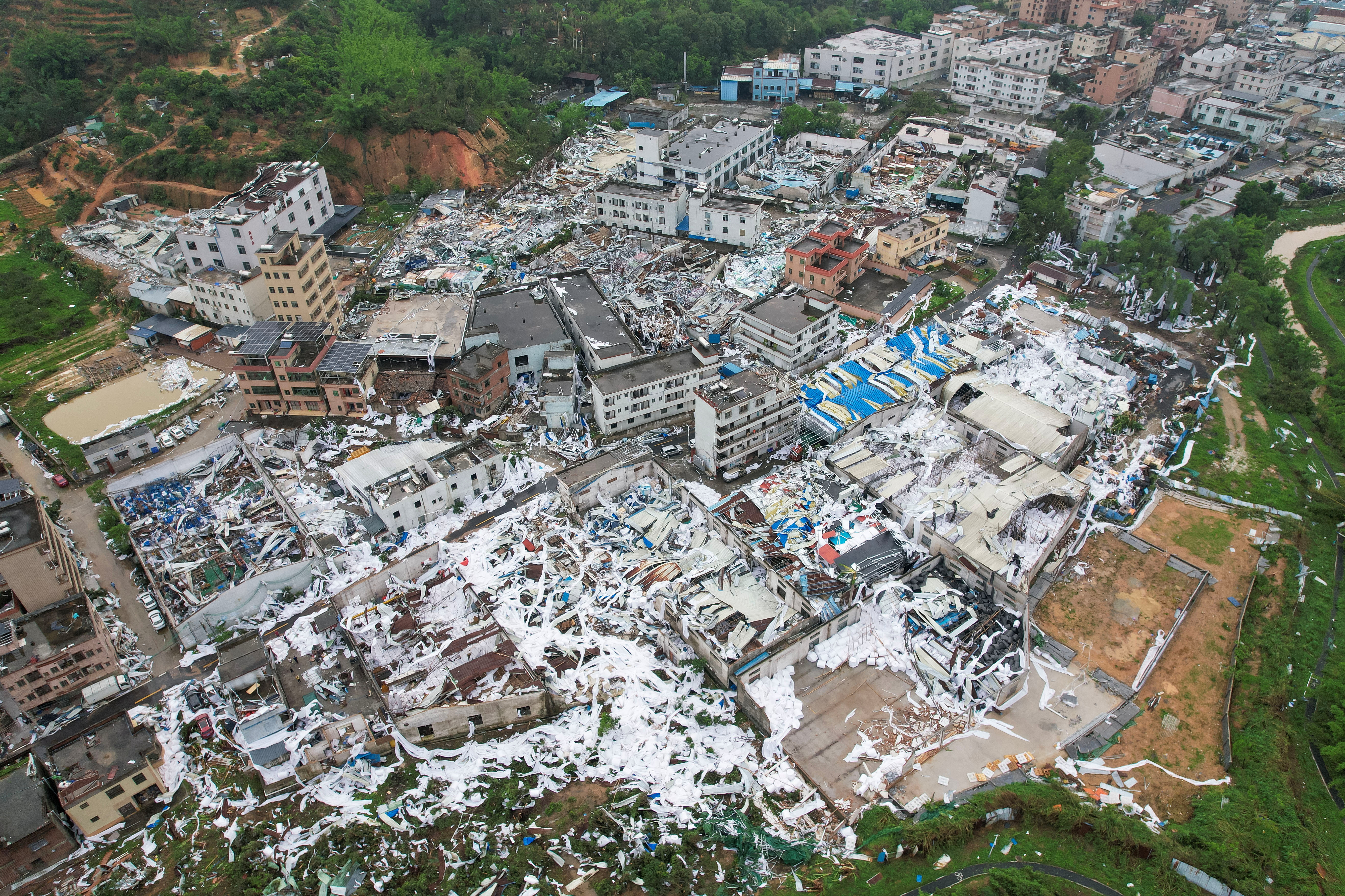 Drone view shows damaged buildings following a tornado at a village in Guangzhou