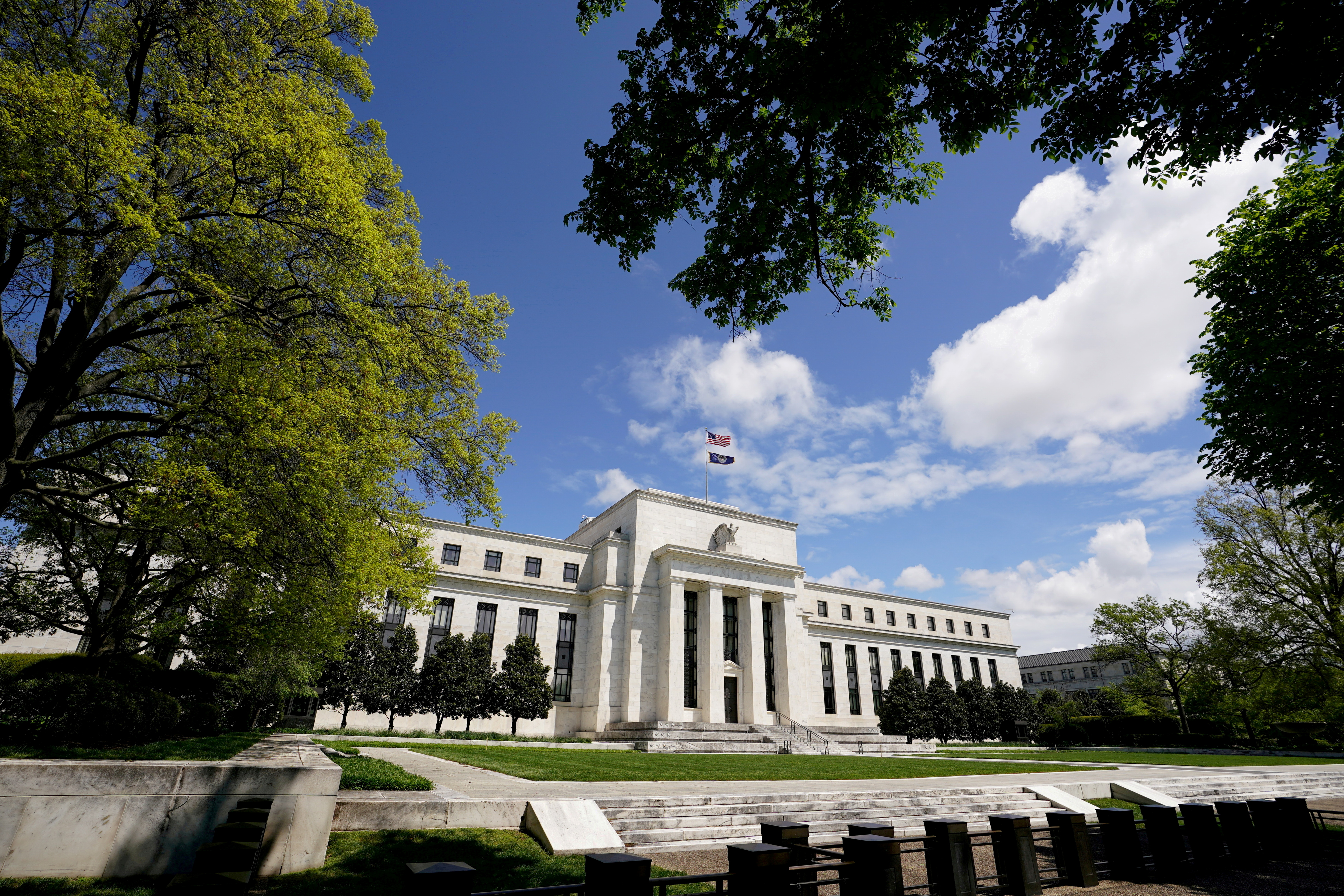 The Federal Reserve building is set against a blue sky in Washington, U.S., May 1, 2020. REUTERS/Kevin Lamarque
