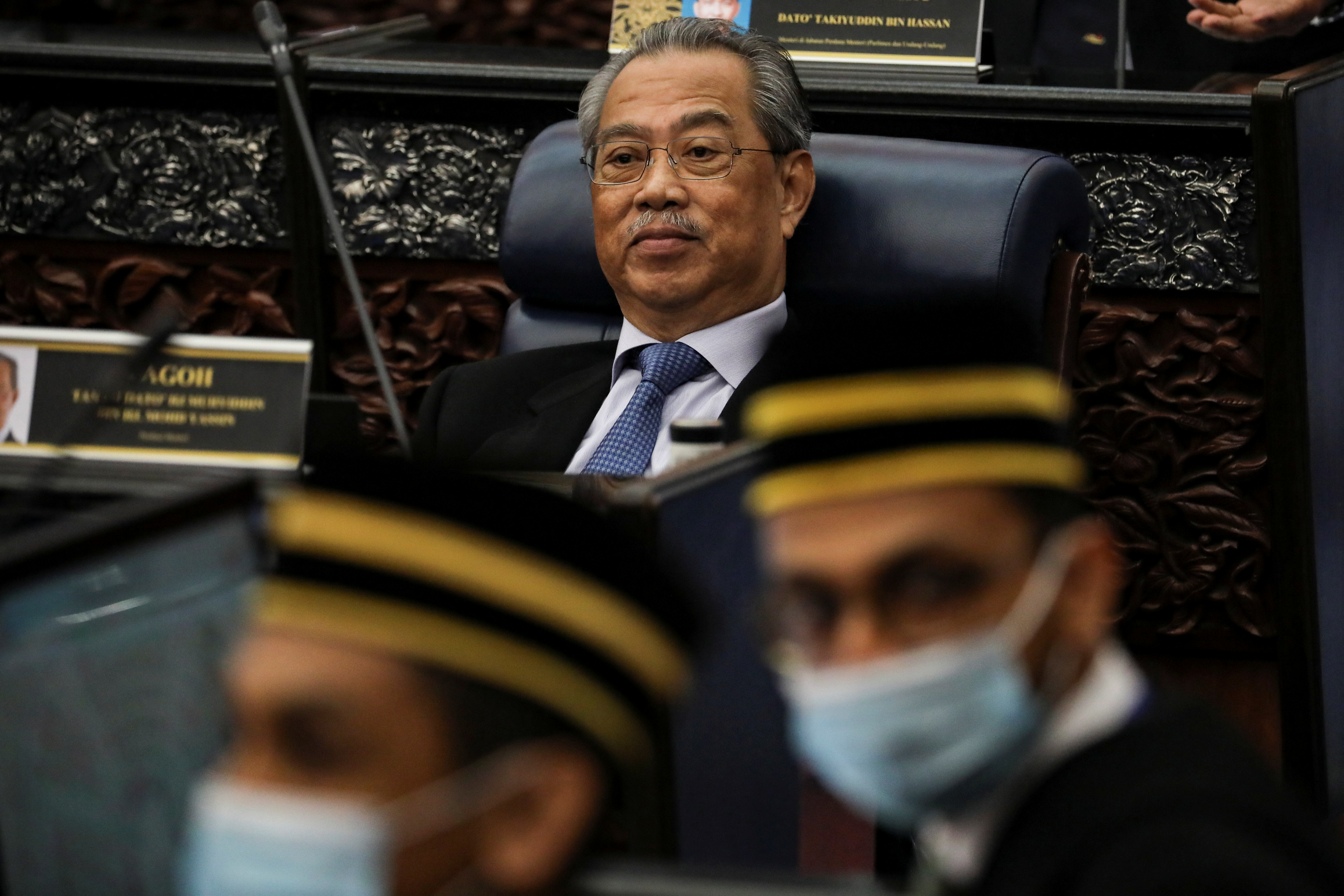 Malaysia's Prime Minister Muhyiddin Yassin reacts during a session of the lower house of parliament, in Kuala Lumpur, Malaysia July 13, 2020. REUTERS/Lim Huey Teng