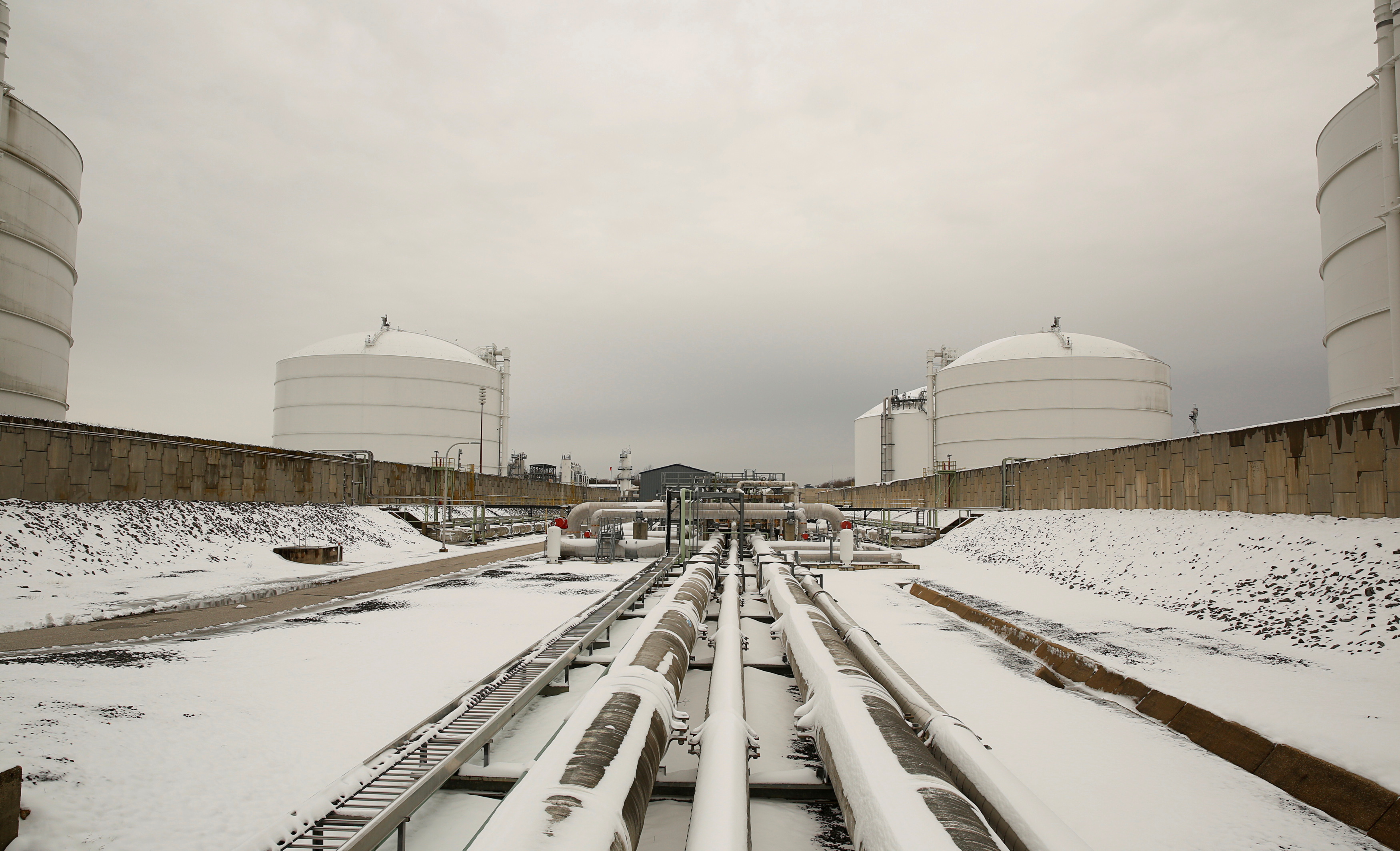 Snow covered transfer lines leading to storage tanks at the Dominion Cove Point Liquefied Natural Gas (LNG) terminal in Lusby, Maryland