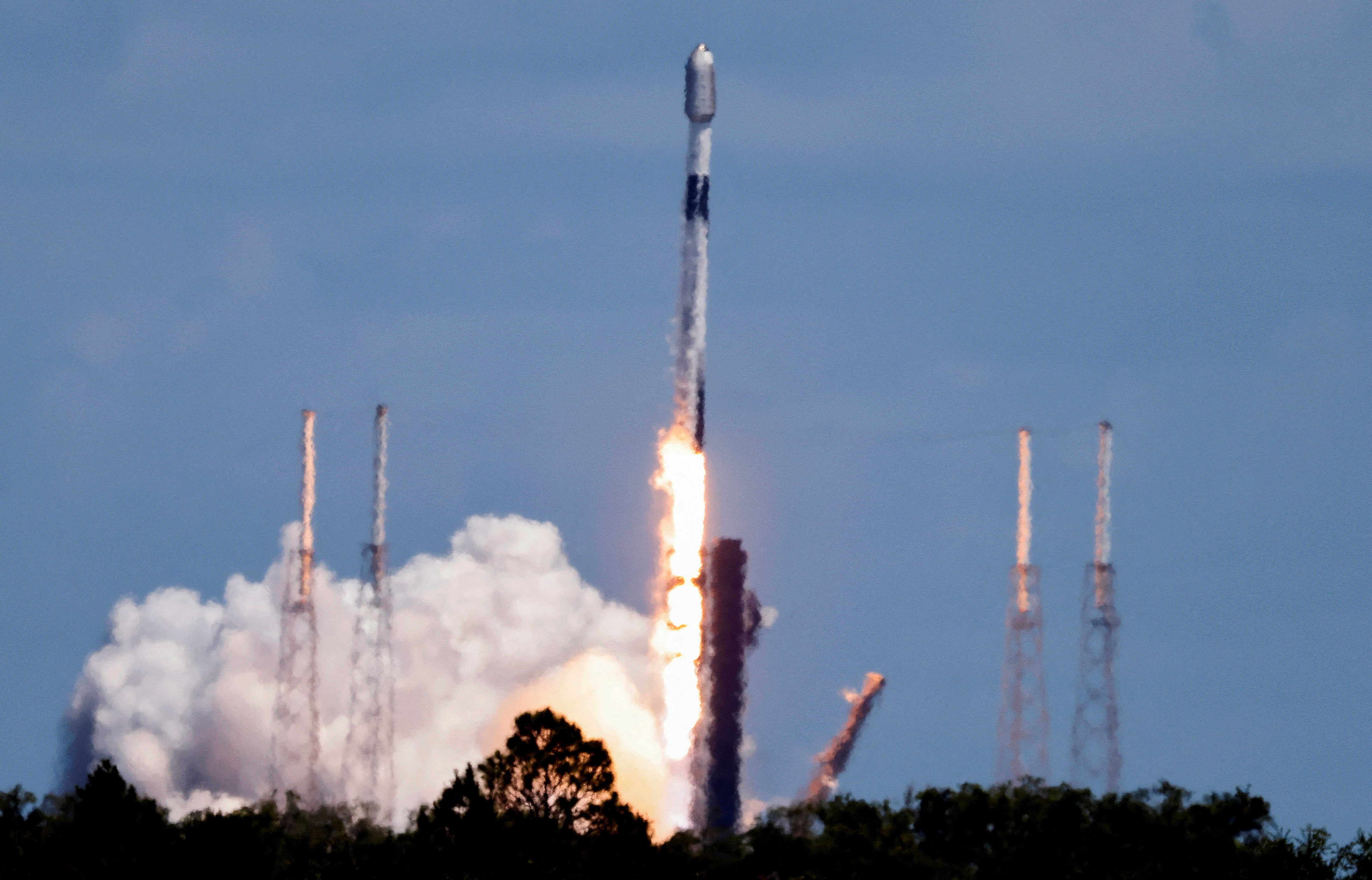 A SpaceX Falcon 9 rocket is launched, carrying 23 Starlink satellites into low Earth orbit