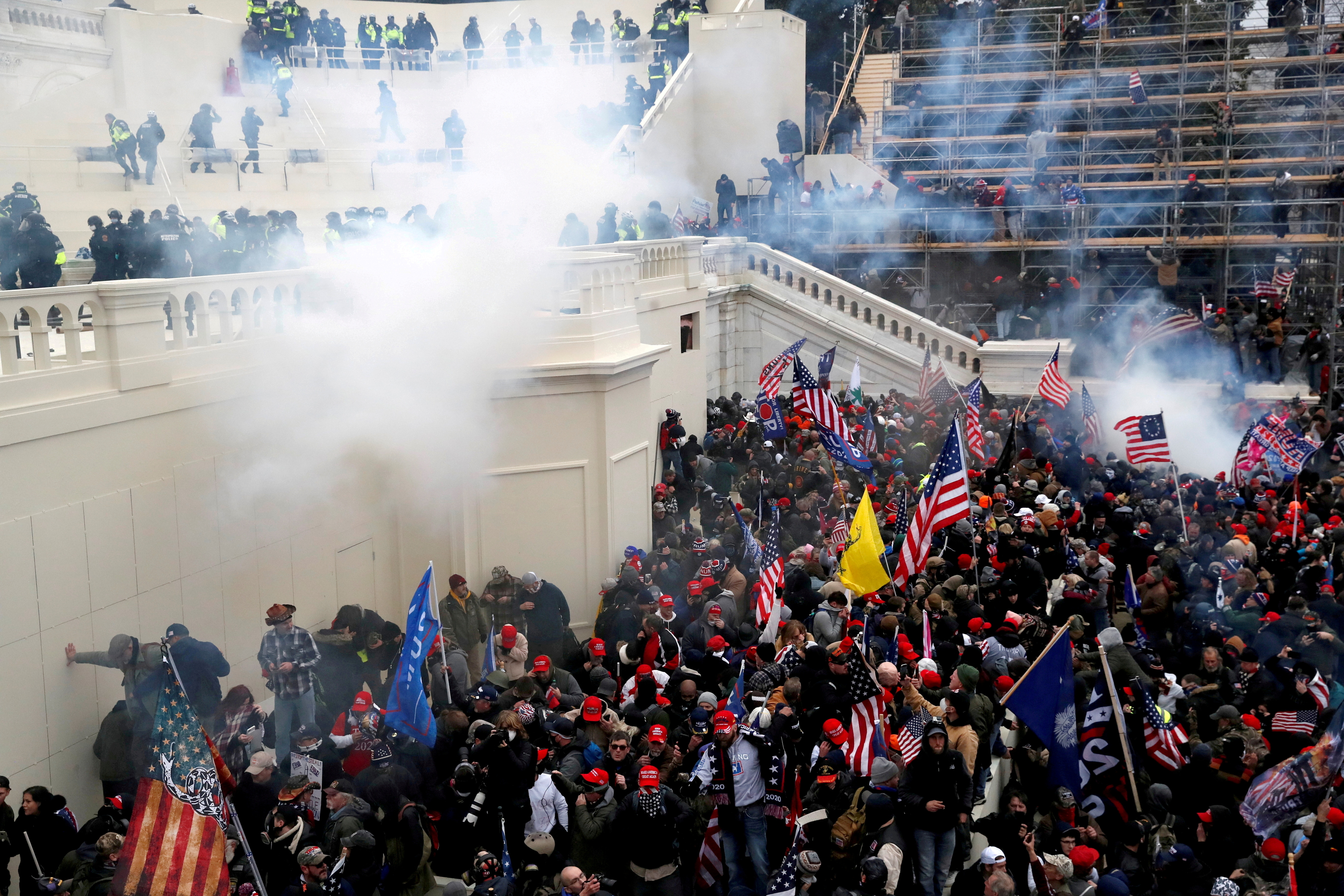 Police release tear gas into a crowd of pro-Trump protesters during clashes at a rally to contest the certification of the 2020 U.S. presidential election results by the U.S. Congress, at the U.S. Capitol Building in Washington, U.S, January 6, 2021. REUTERS/Shannon Stapleton//File Photo