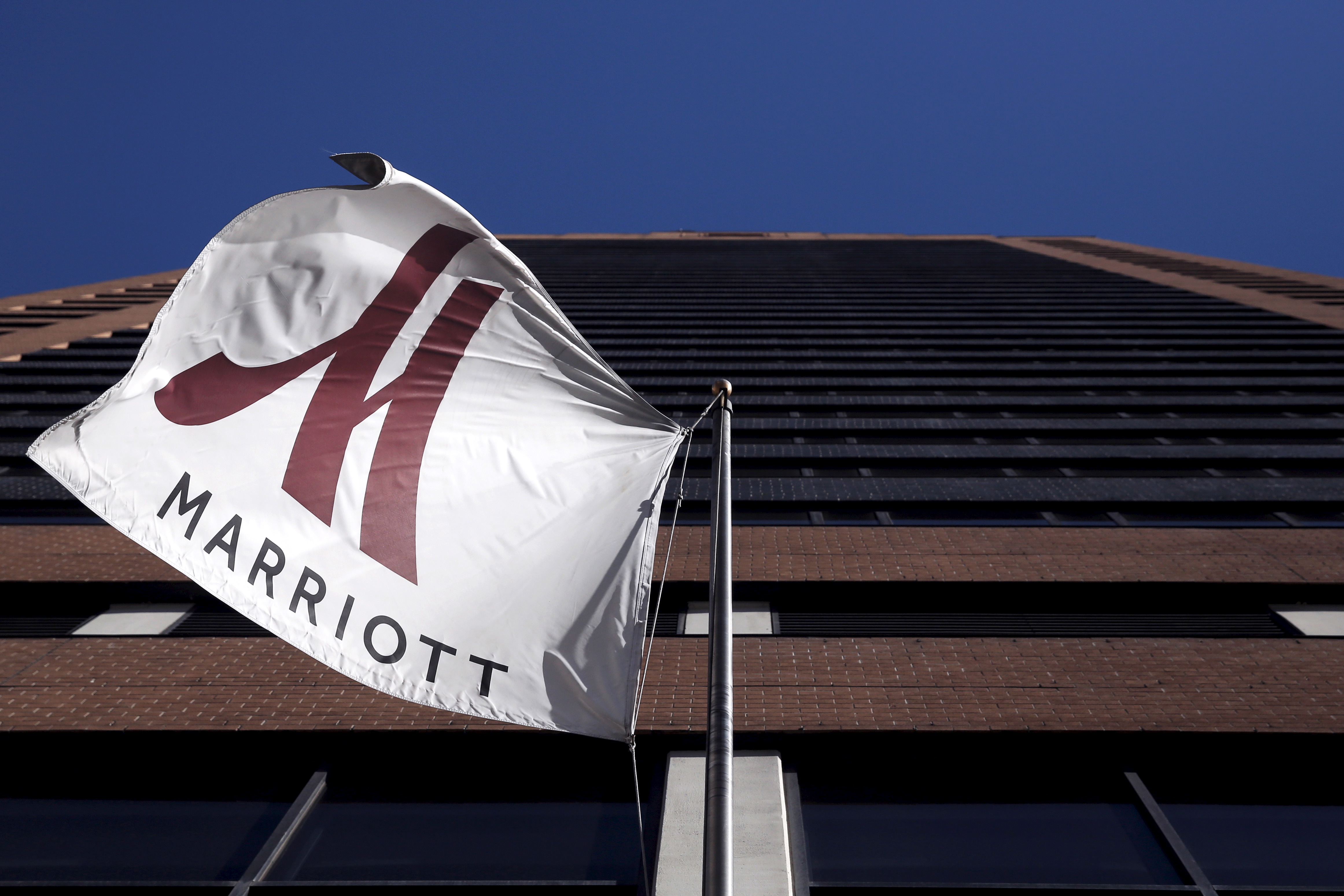 A Marriott flag hangs at the entrance of the New York Marriott Downtown hotel in Manhattan, New York