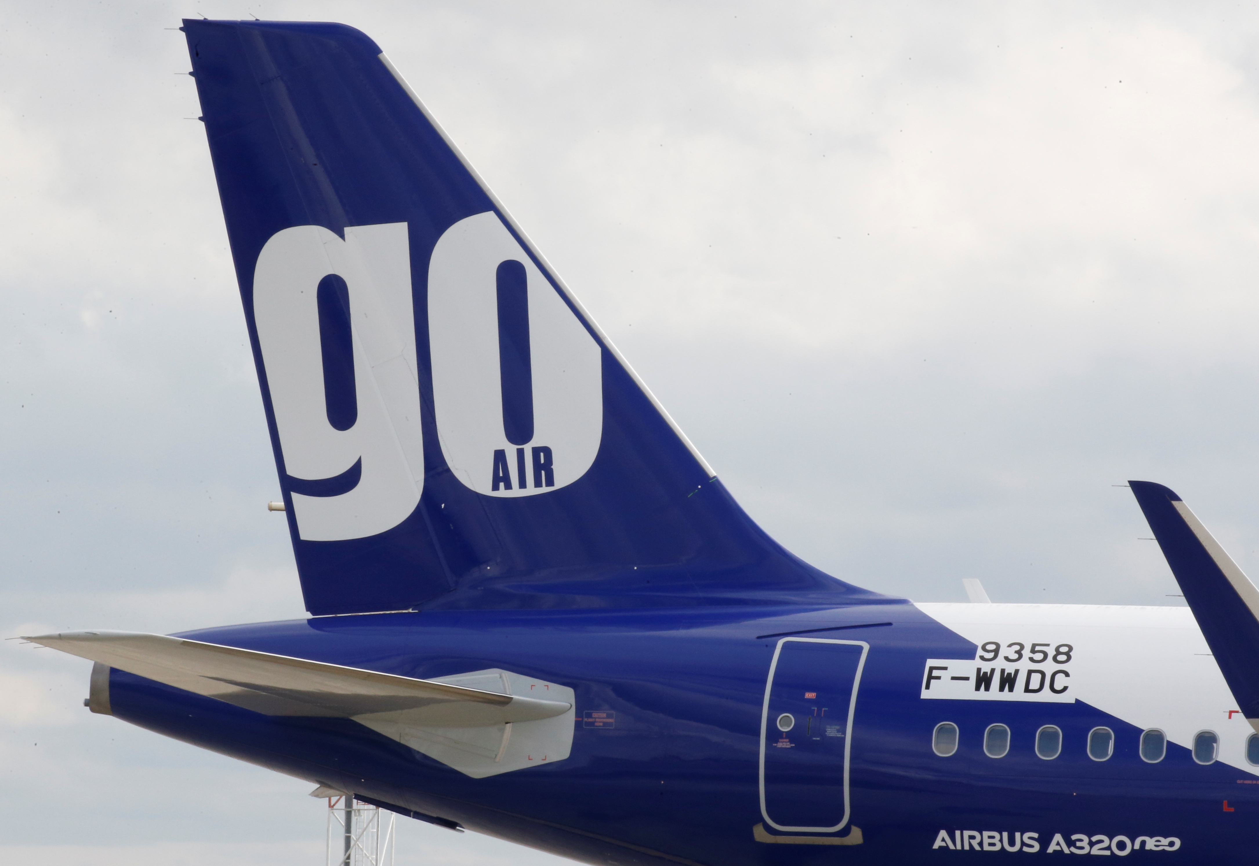 The logo of GoAir airline is pictured on an A320neo aircraft at the builder's headquarters of Airbus in Colomiers near Toulouse