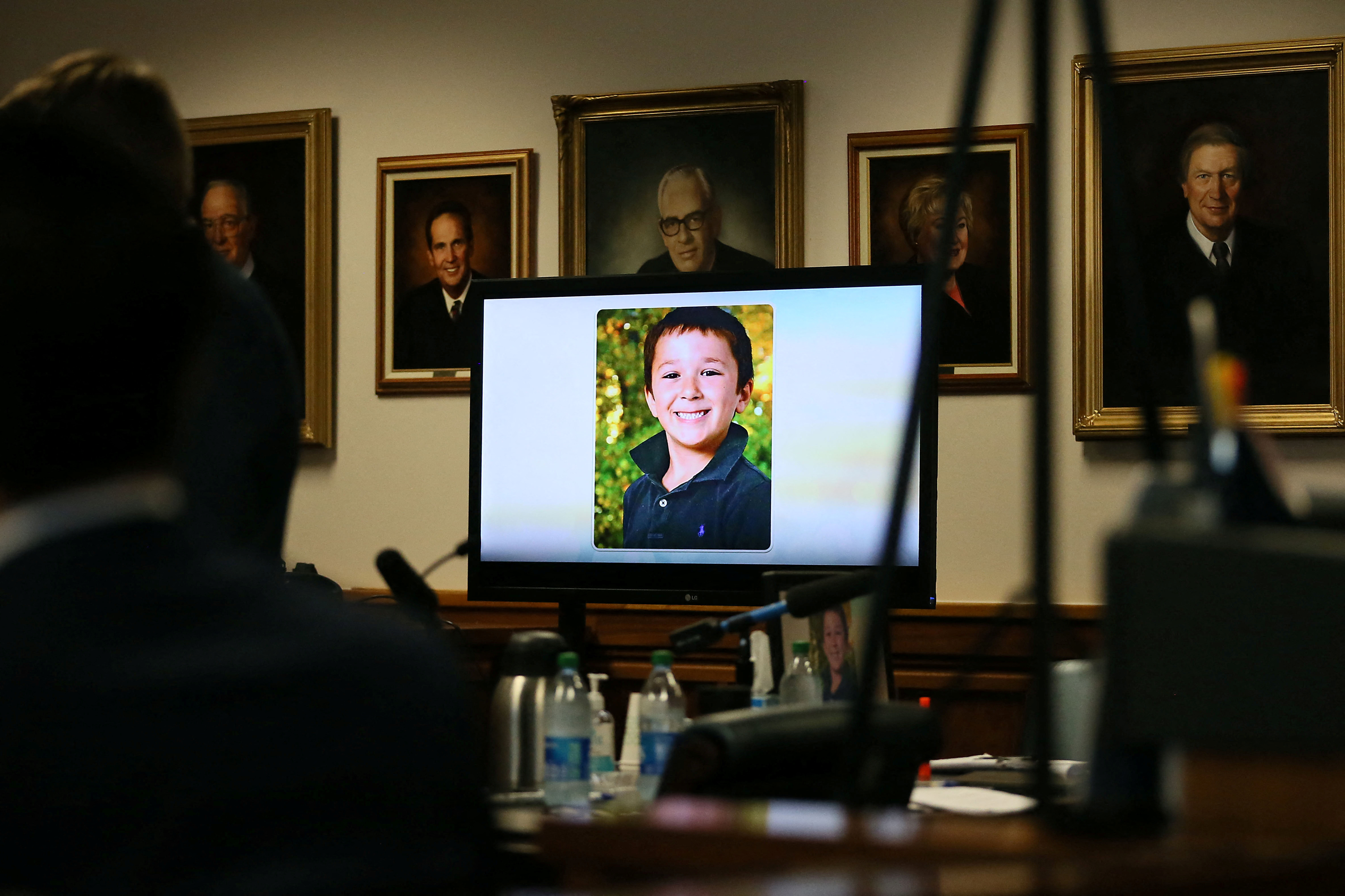 Sandy Hook shooting victim is displayed on the screen during the Alex Jones jury trial in Austin