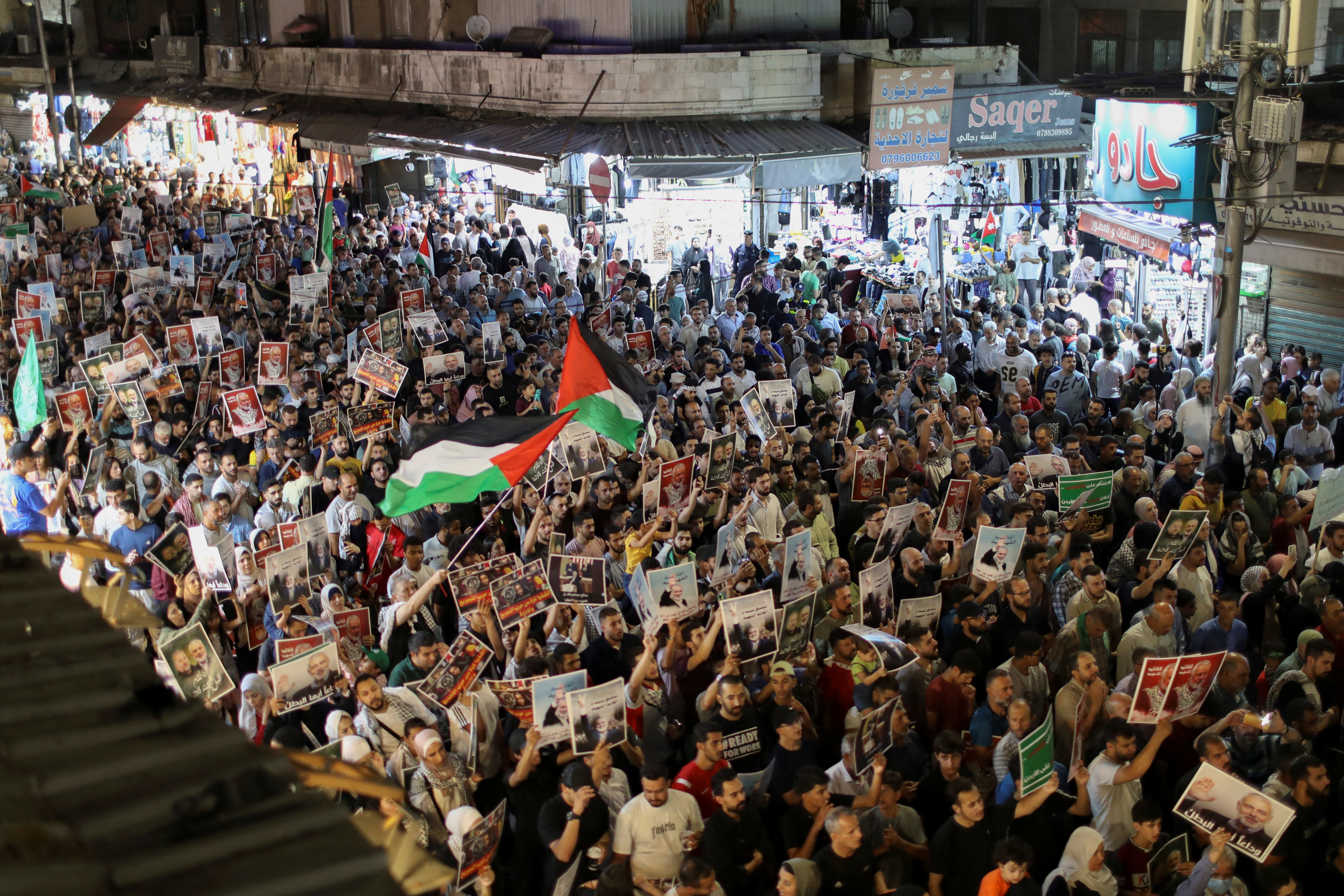 Demonstrators take part in a symbolic funeral for Hamas leader Ismail Haniyeh who was killed, in Amman