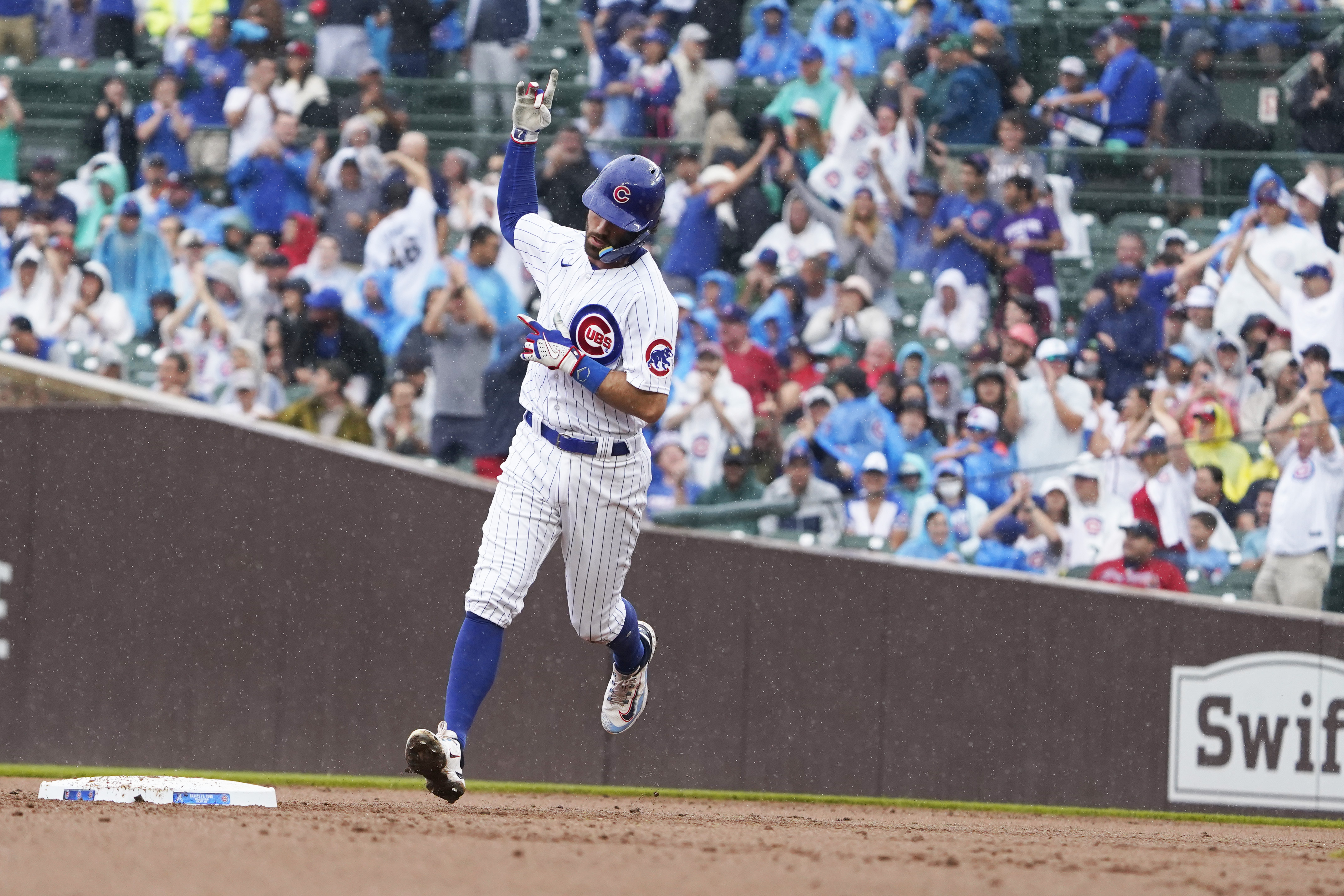 Swanson and Candelario go deep as the Cubs hold off the Braves 8-6 at rainy  Wrigley - ABC News