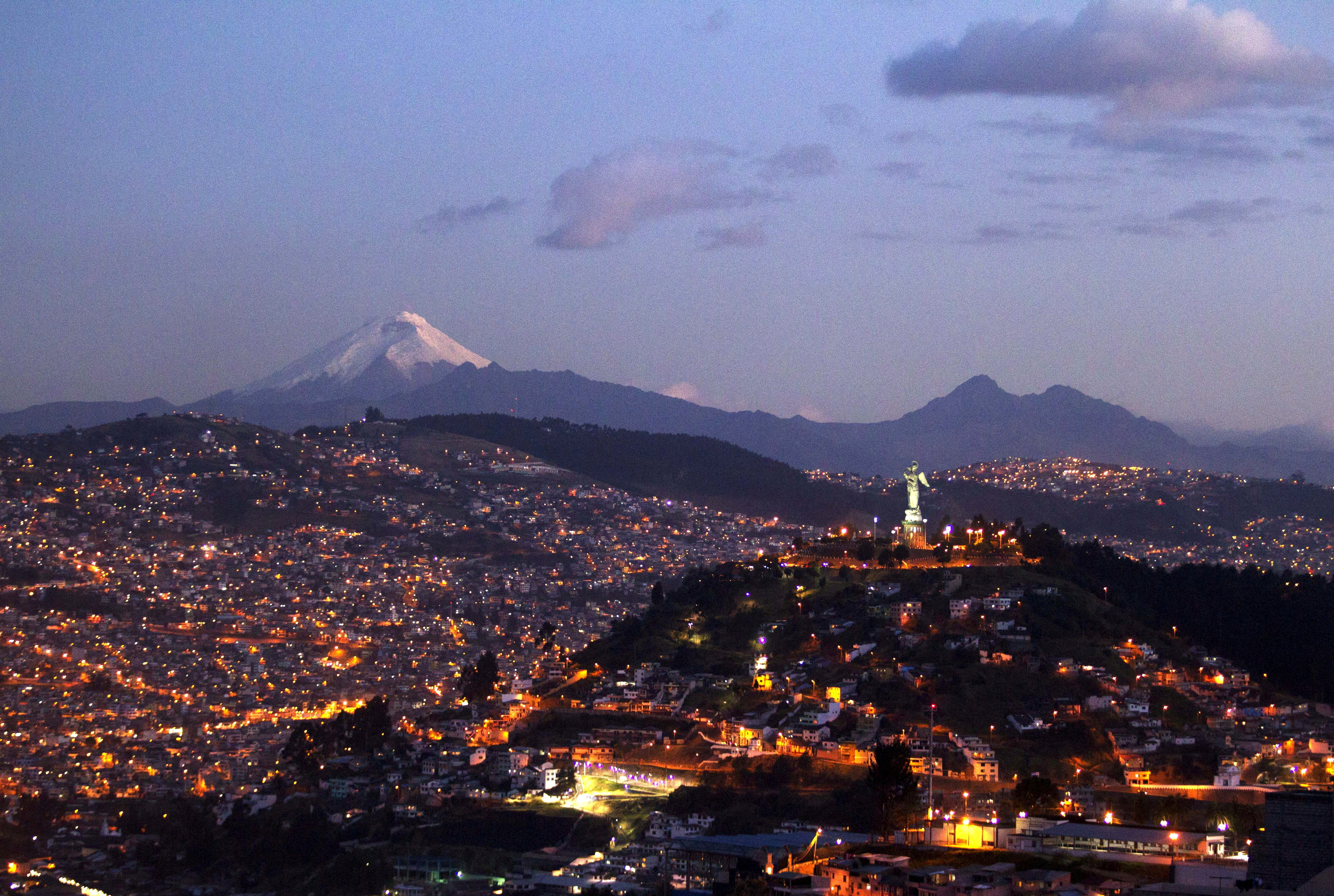 Ecuador's capital city, Quito, is pictured with the Cotopaxi volcano in background