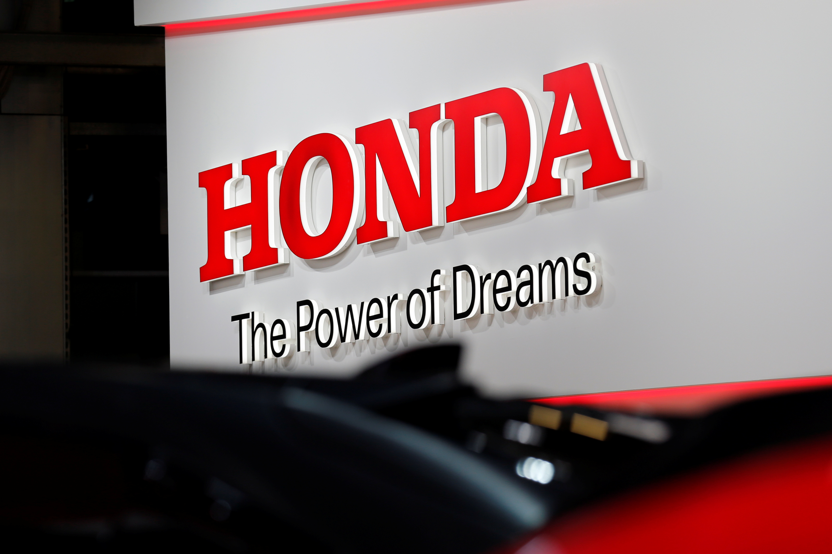 A Honda logo is seen on media day at the Paris auto show