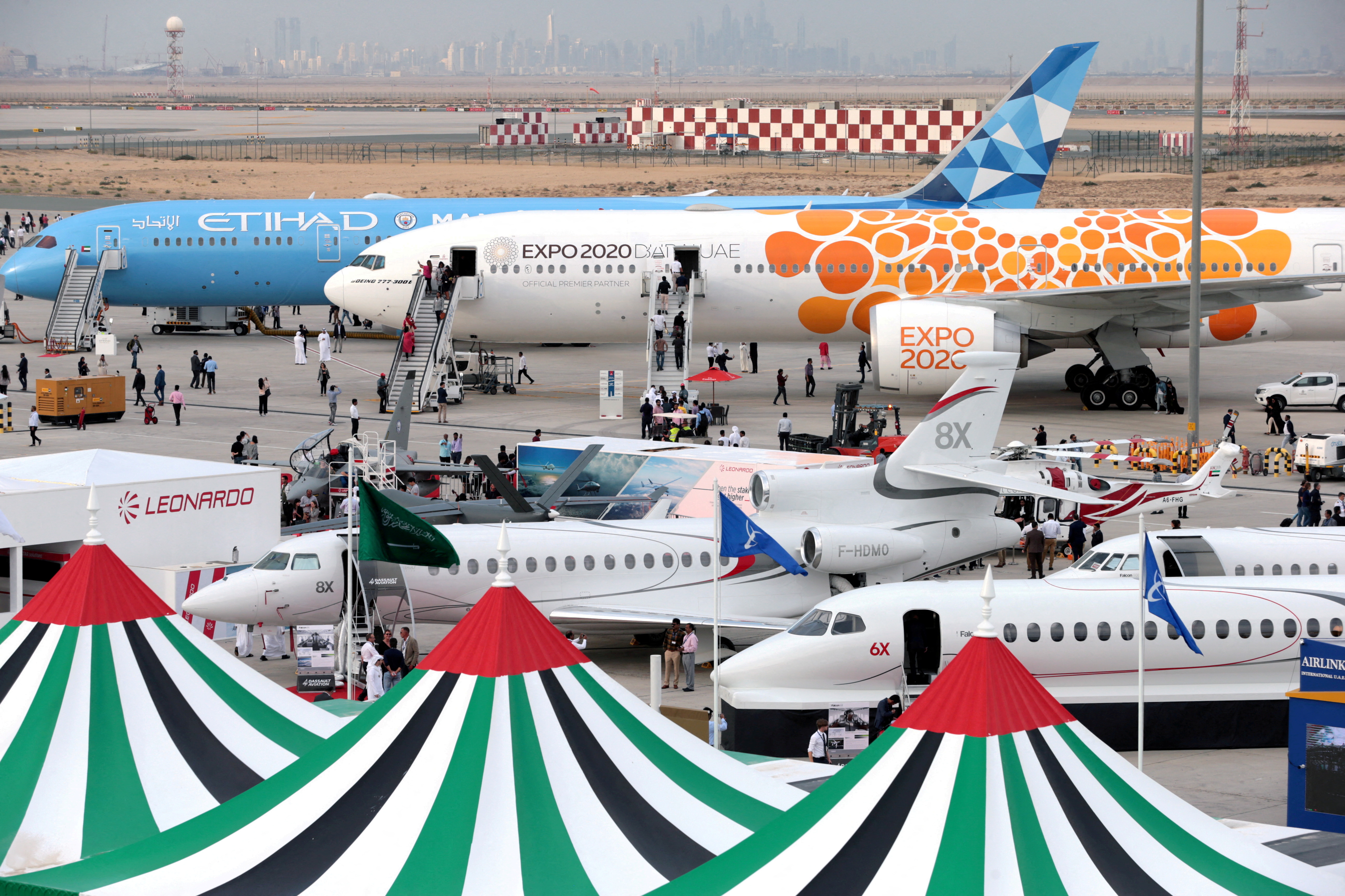 Aircraft sit on static display during the fifth day of Dubai Air Show in Dubai