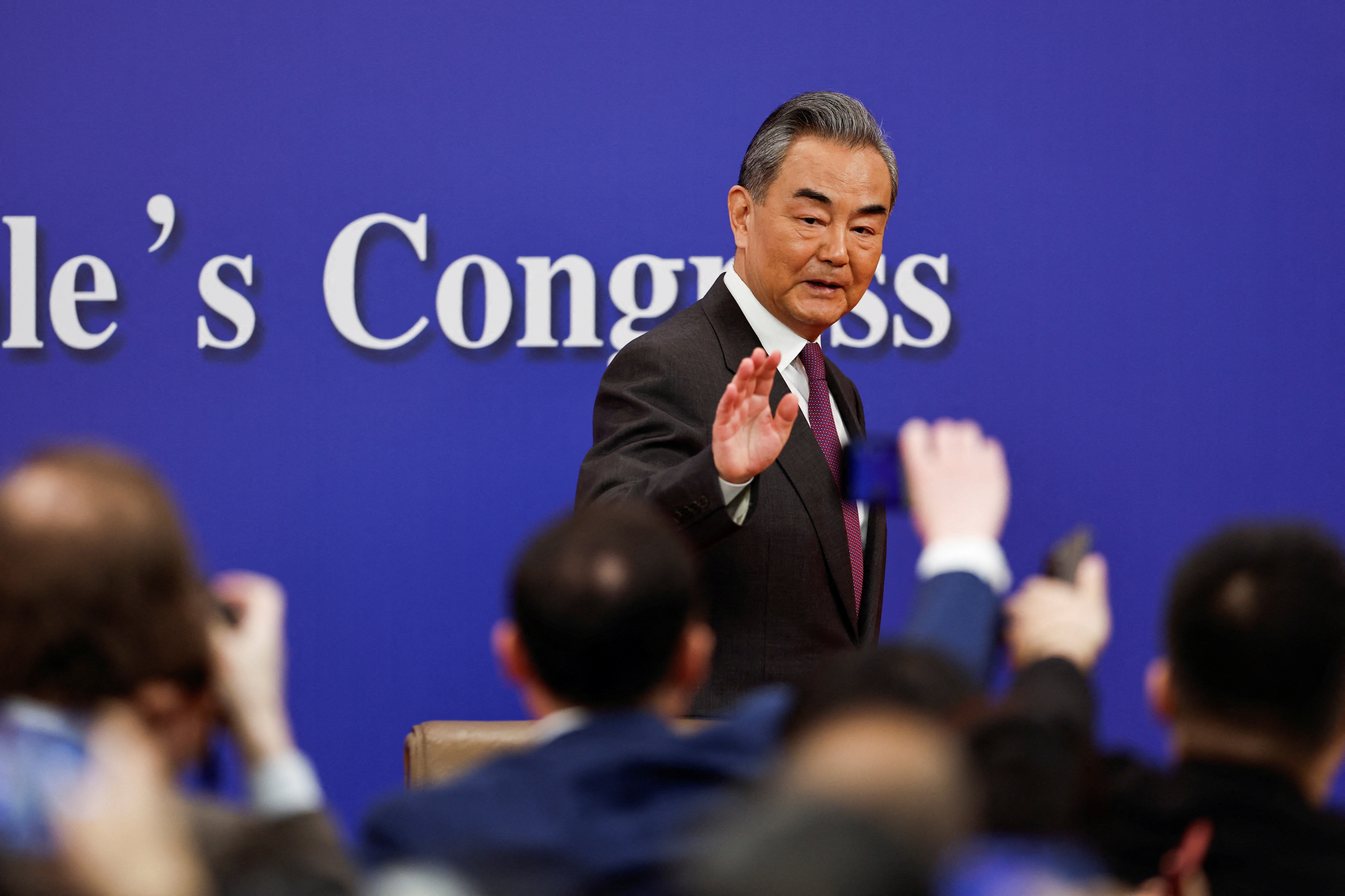 Chinese Foreign Minister Wang Yi attends a press conference on the sidelines of the NPC, in Beijing