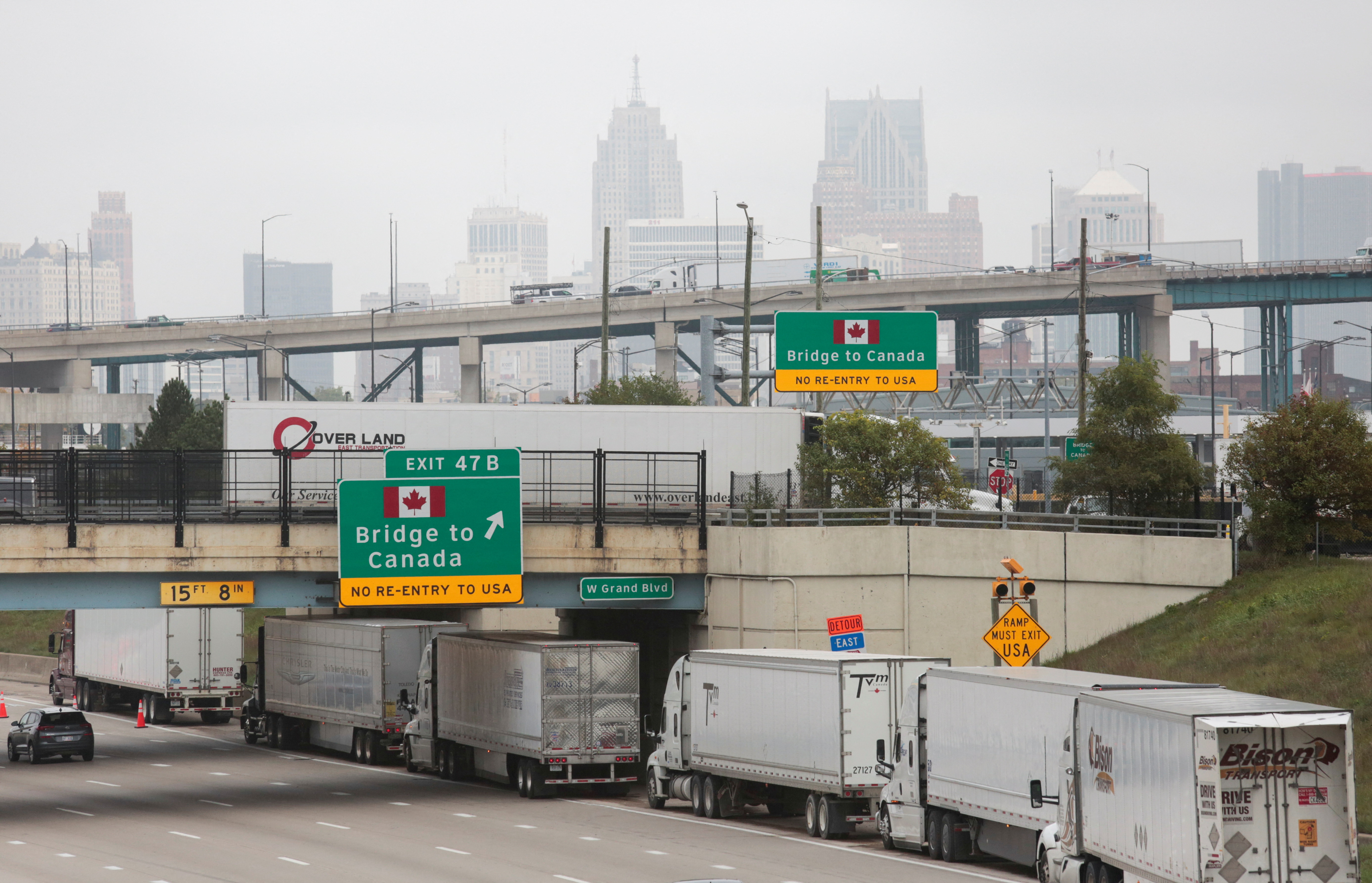 Truck drivers wait in a long line to cross the Ambassador Bridge, which Canadian police closed to search for possible explosives in a vehicle, in Detroit, Michigan, U.S. October 4, 2021.  REUTERS/Rebecca Cook