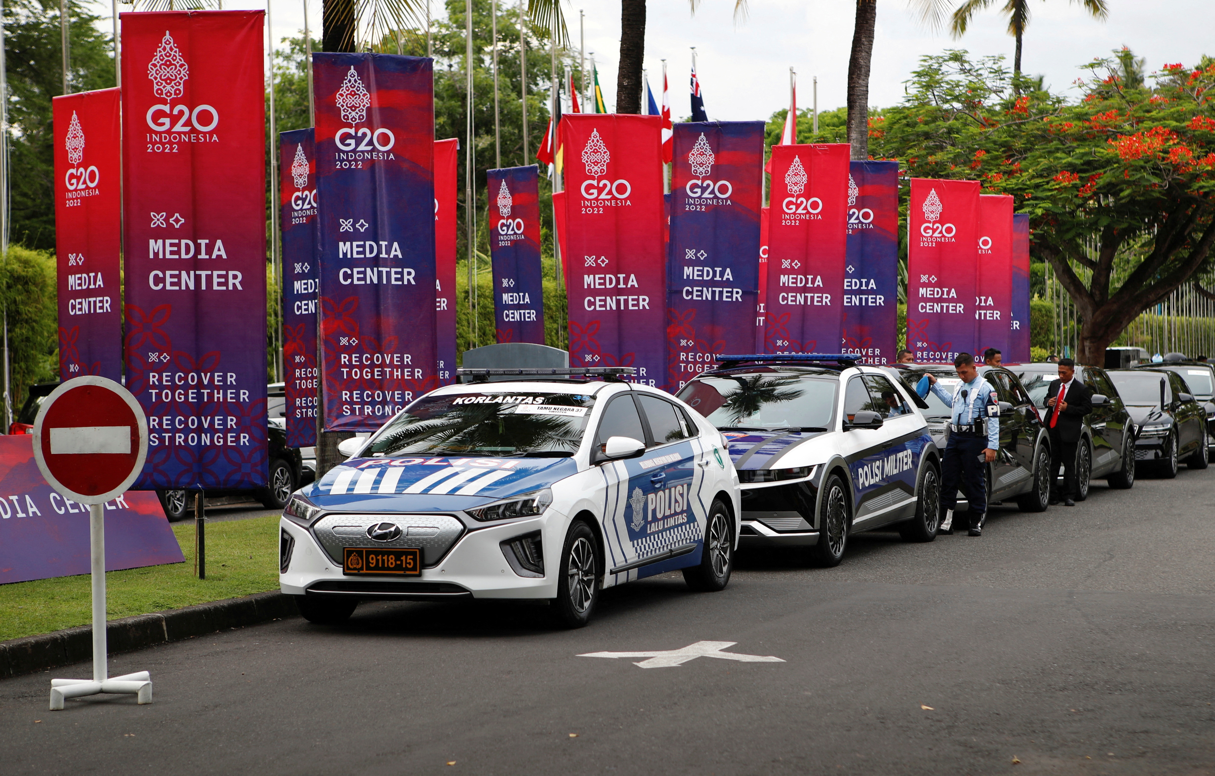 Electric cars park at the entrance of the venue ahead of the G20 summit in Nusa Dua