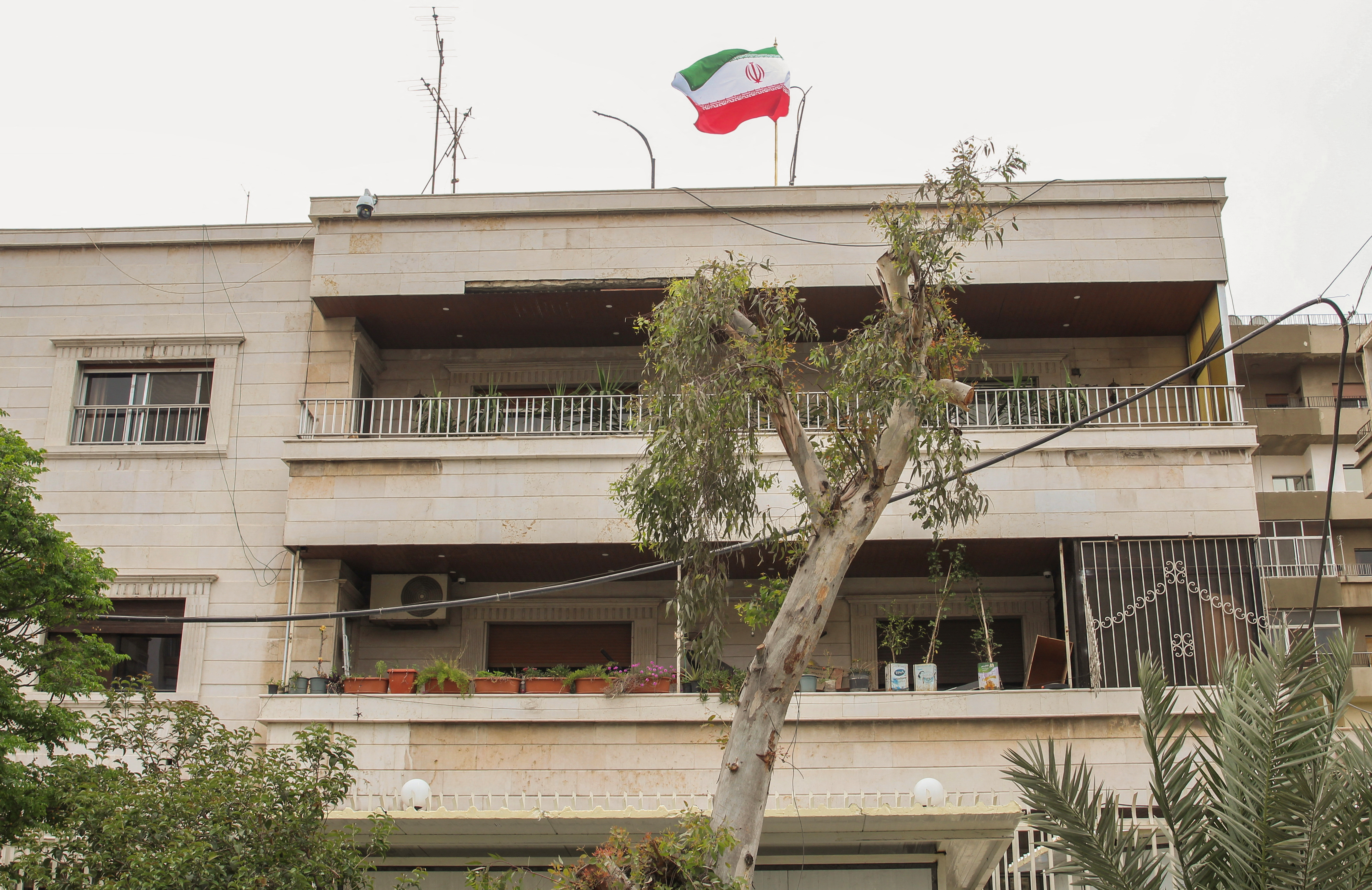Iranian flag flutters on new Iranian consulate building after Iran's consulate in Damascus was targeted in a suspected Israeli attack on Monday April 1, in Damascus