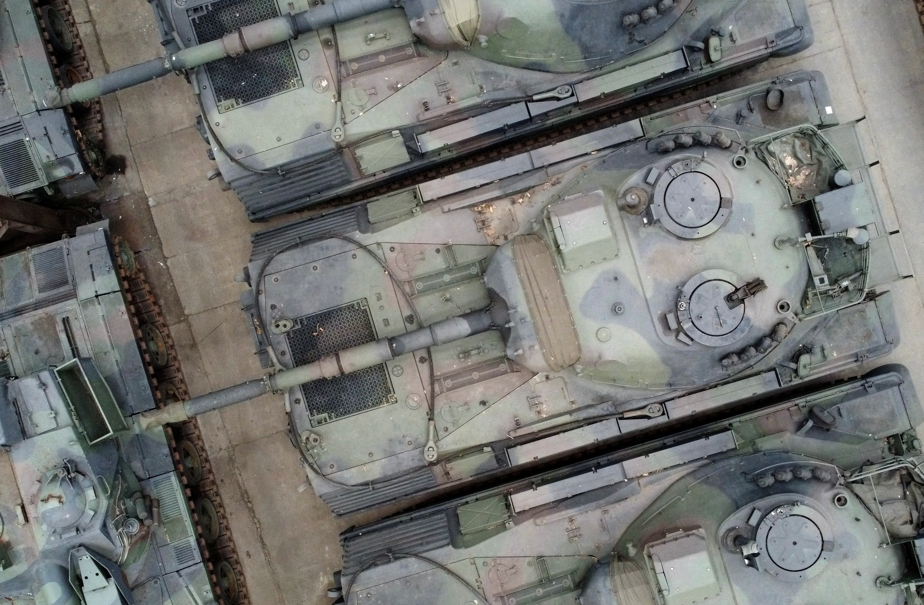 Dozens of German-made Leopard 1 tanks are seen in an hangar in Tournais