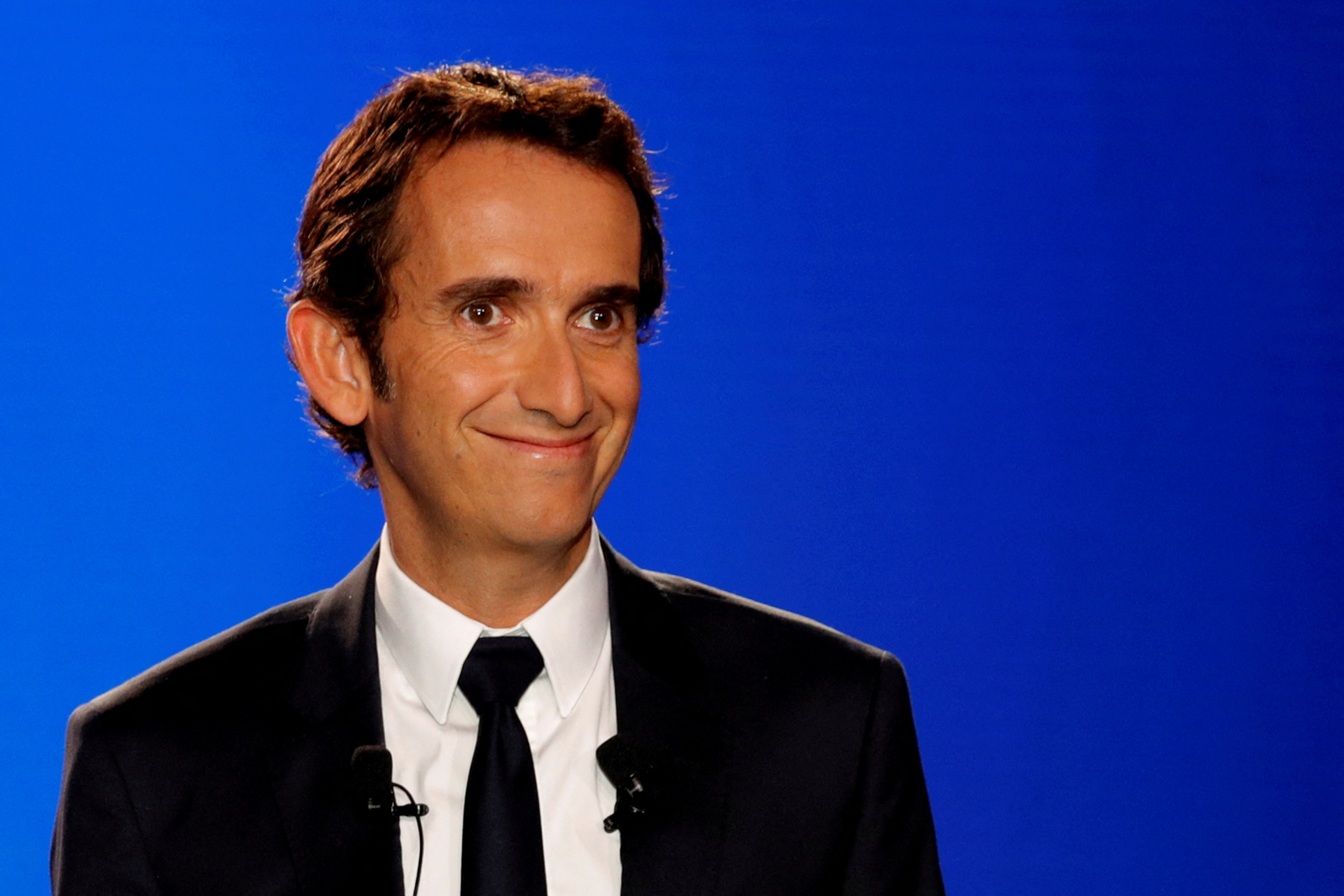 Alexandre Bompard, CEO of French retailer Carrefour, poses before a news conference in La Defense near Paris