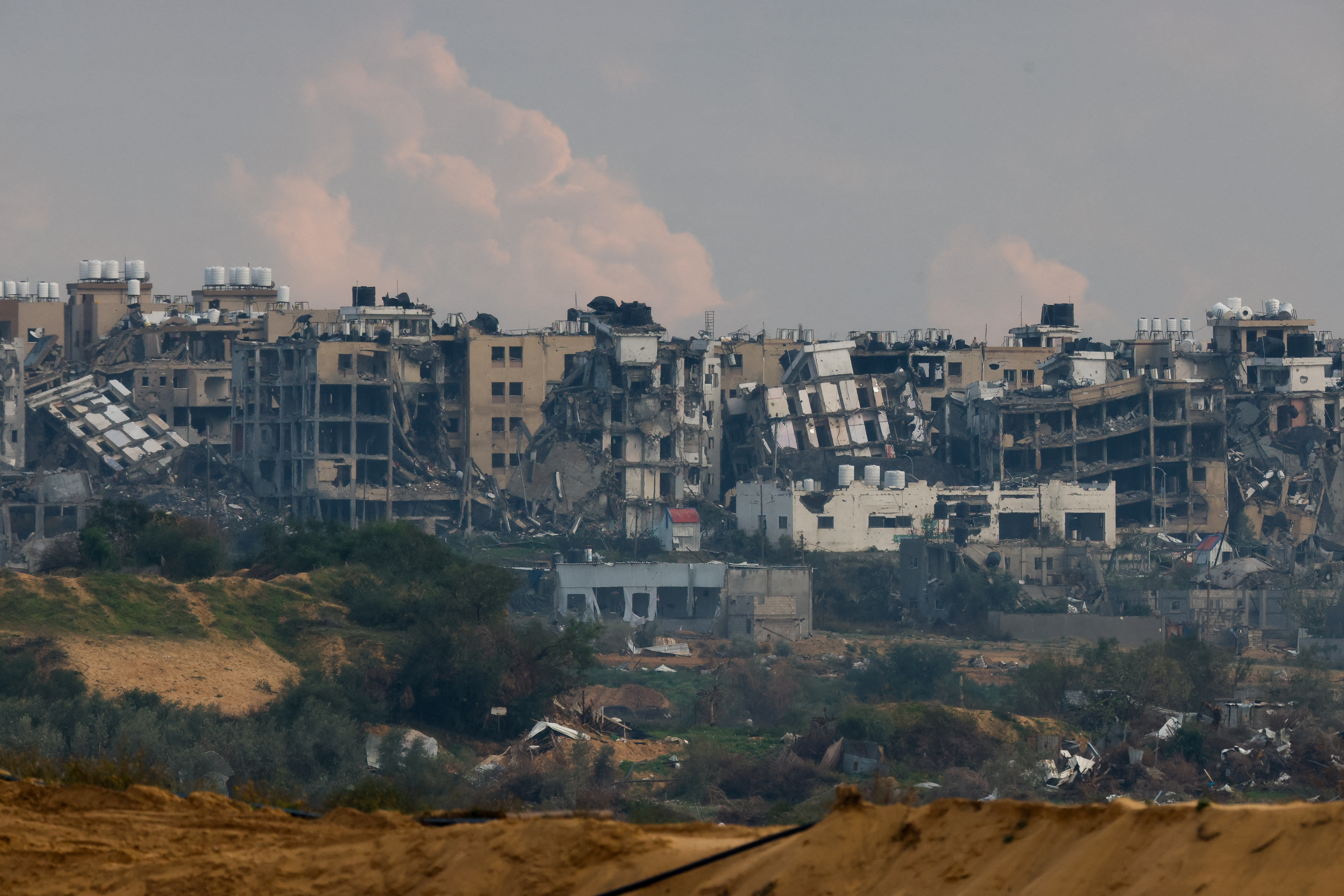 Destroyed buildings lie in ruin in the Gaza Strip, as seen from Israel
