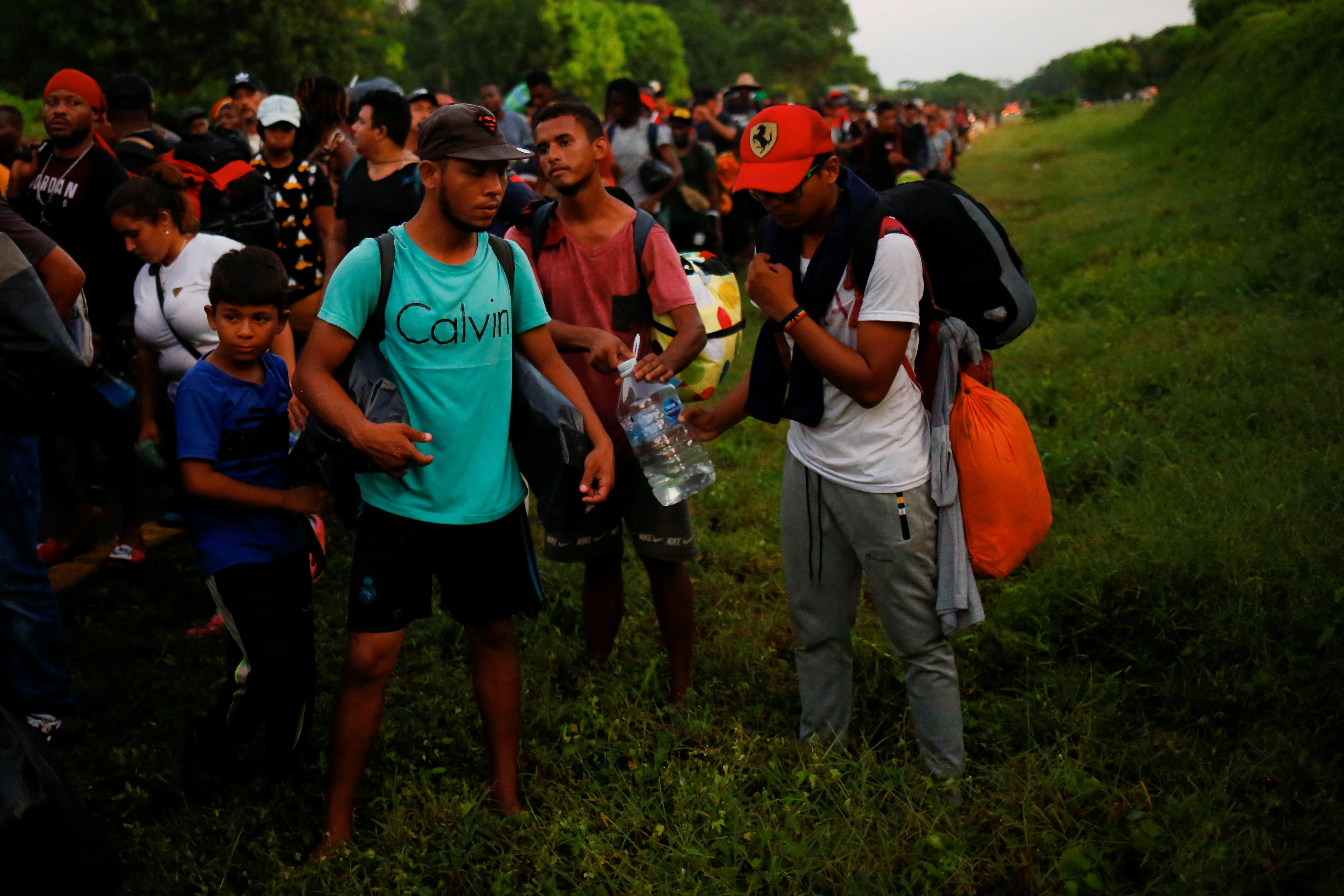 Migrants from Venezuela join in the caravan heading to the U.S. border near Villa Comaltitlan, Mexico November 20, 2021. REUTERS/Jose Luis Gonzalez